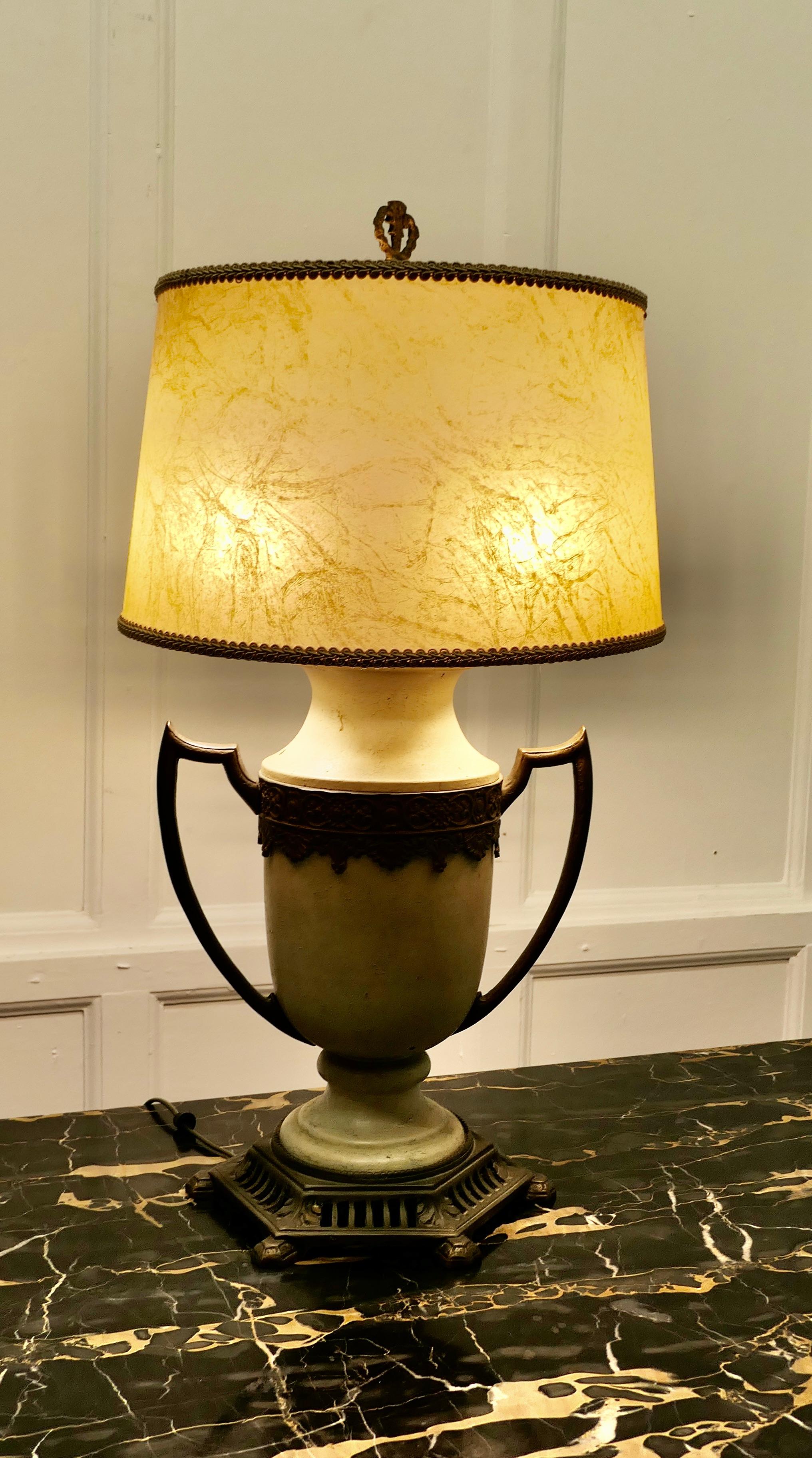 A Large French Toleware and Brass Table Lamp 

This Large Toleware Lamp is set on a  brass  base and has decorative brass work and handles and comes with its original Velum lampshade 

The lamp is in good condition, a statement piece in any room
The