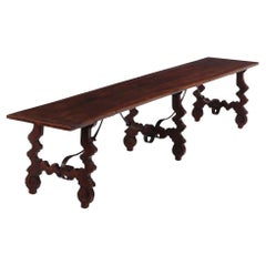 A.I.C., grande table de réfectoire en noyer et en fer.