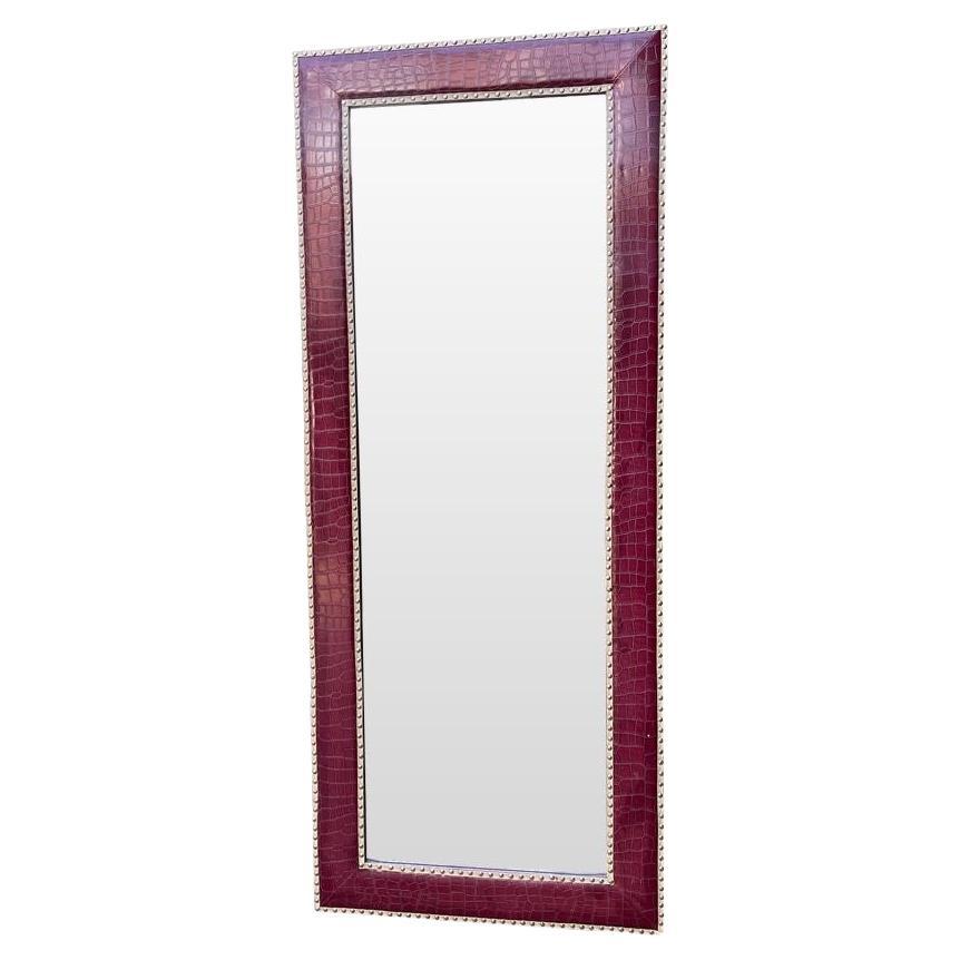 A large full length mirror with burgundy faux crocodile skin frame. For Sale