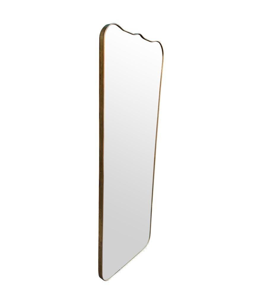 A large full length orignal Italian 1950s brass framed mirror, with wonderful curved shaped, scolloped top detail and solid wood back. 