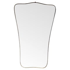 A large full length original Italian shield mirror in the Gio Ponti style