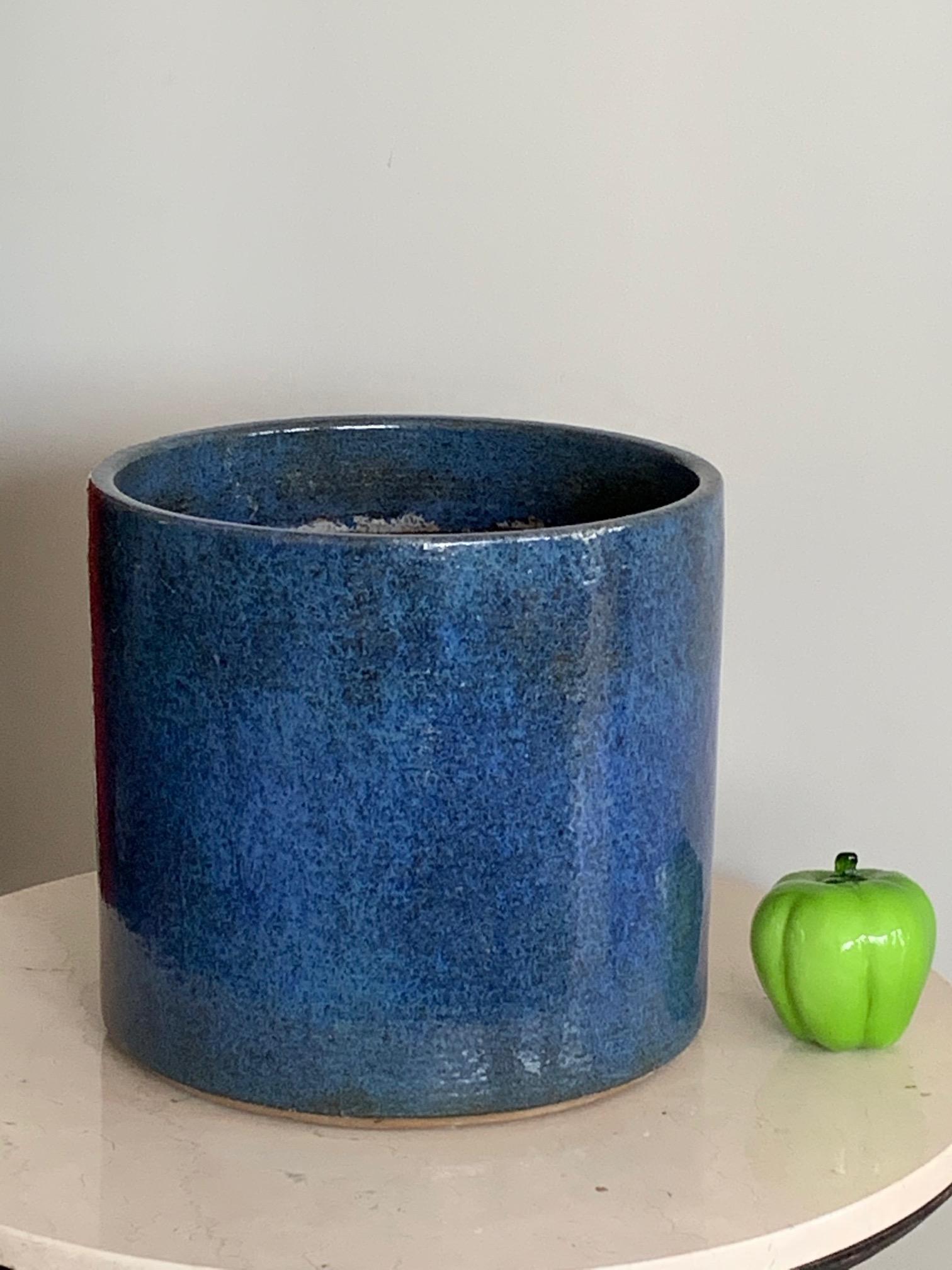 A rare and unusual planter/ceramic pot by Gainey Ceramics of California. Beautiful shiny glaze with various hues of blue. Stamped on the bottom, handmade, model AC-12. Measures: approx. 12.5