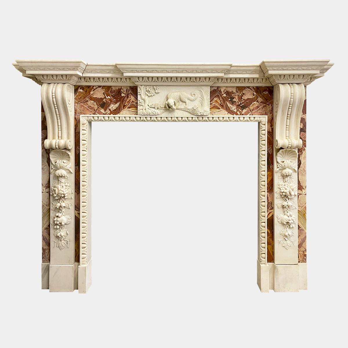 A substantial and very good quality copy of an 18th century Irish fireplace. An abundant use of Italian Jasper marble with white marble carved vines and foliage adorning the jambs. Egg and dart moulded interior slips and along the under moulding of