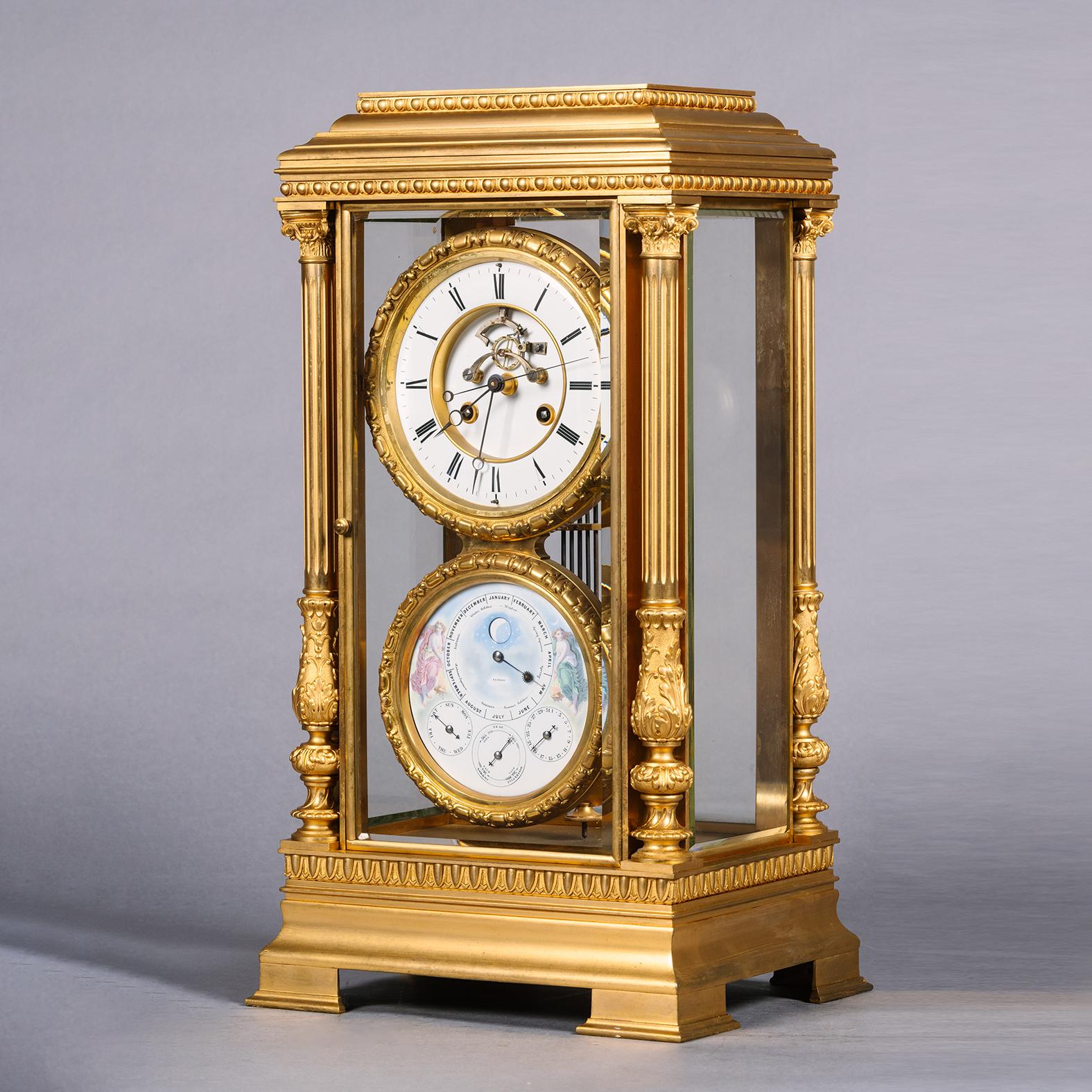 A Large Gilt-Bronze Four-Glass Mantel Regulator Calendar Clock.

The architectural case composed of two columns supporting a stepped top. The front and back with bevel glazed doors. The enamel clock dial with 4