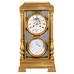 Grande horloge régulatrice à quatre glaces en bronze doré pour cheminée