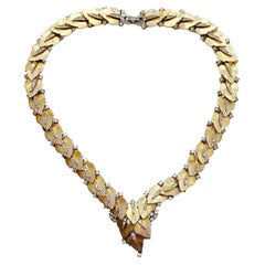 Eine große Halskette aus vergoldetem Metall und Klarpaste mit Blättern, Marcel Boucher, USA, 1960er Jahre.