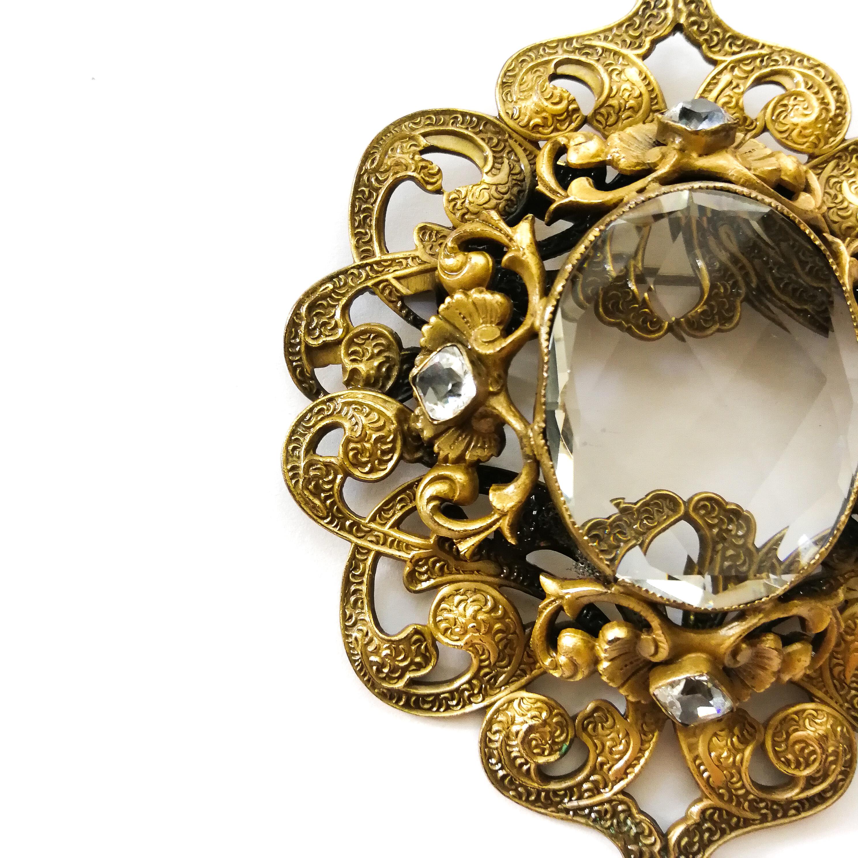 A large gilt metal Baroque brooch with large central stone, Joseff Of Hollywood. In Good Condition In Greyabbey, County Down