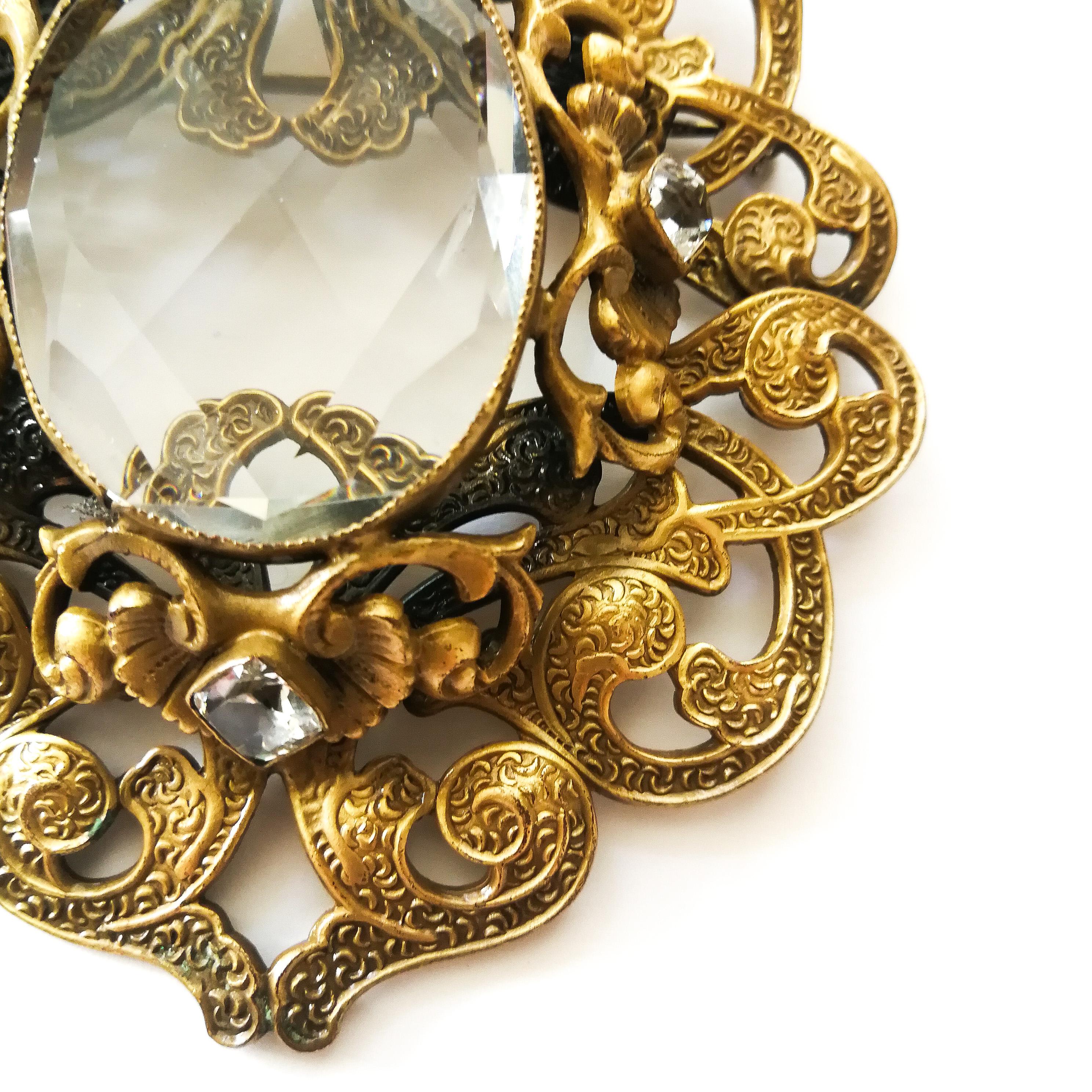 A large gilt metal Baroque brooch with large central stone, Joseff Of Hollywood. 1