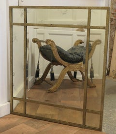 A Large Gilt Metal Margin Wall Mirror  The mirror has a Simple Metal Frame