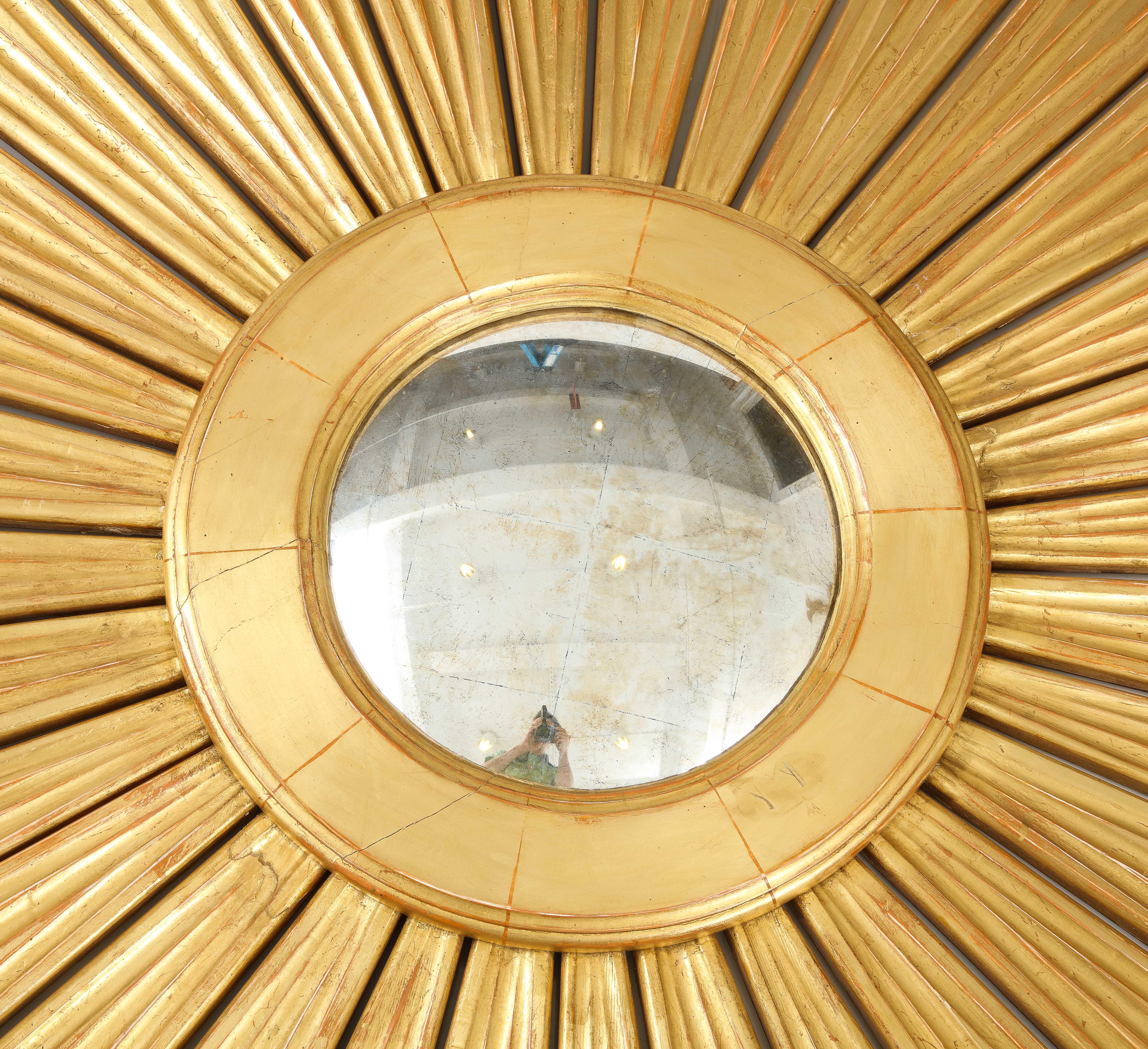 North American A Large Giltwood Sunburst Mirror For Sale
