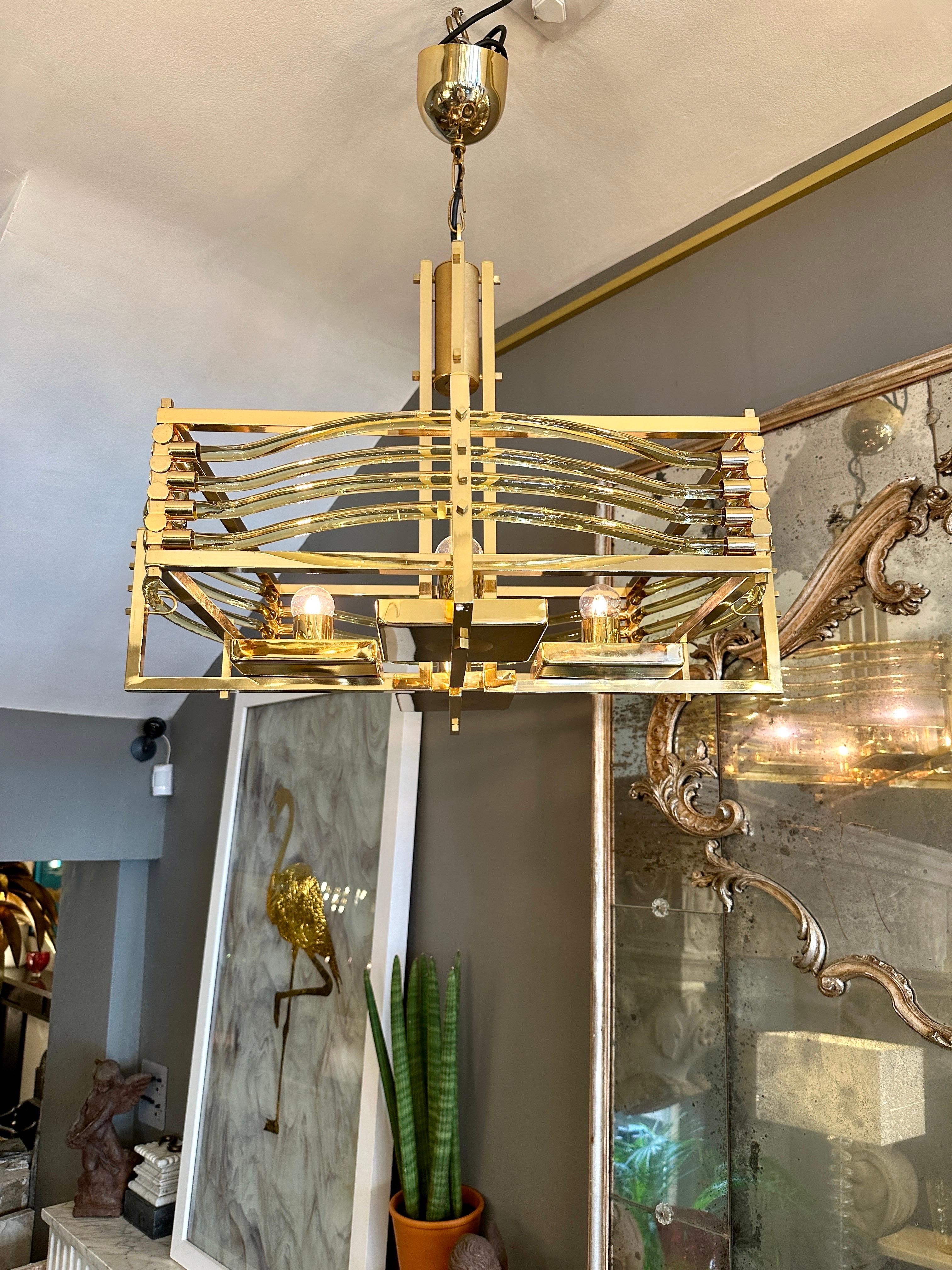 A large gold plated with curved and shaped Murano glass amber or gold glass tube diffusers. One of 3 similar lights imported from Rome. Available in other listings and In very good condition. 
 A Rare model by Gaetano Sciolari in Gold Plate and