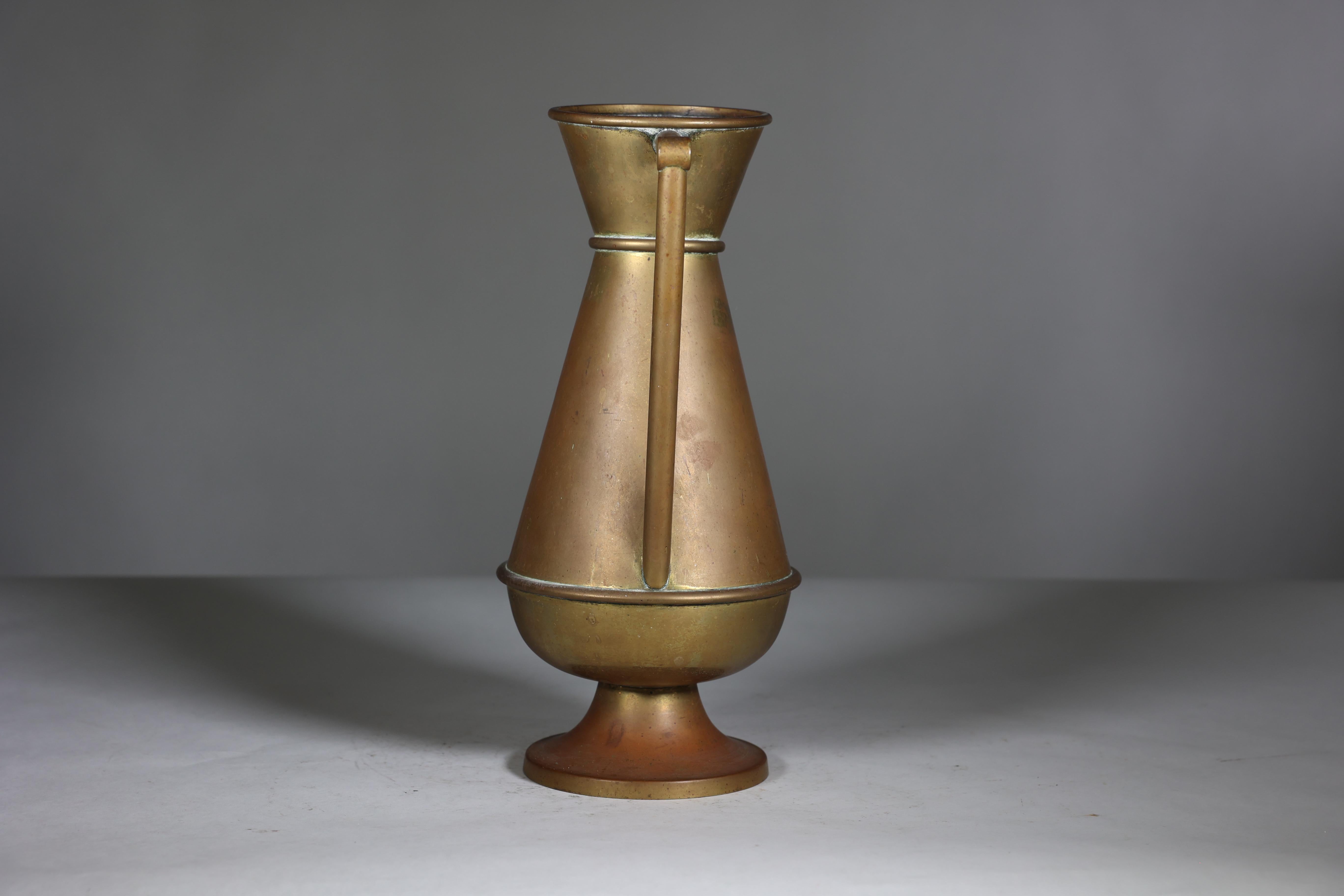 A large Gothic Revival heavy brass jug with a simple angular form that feels well balanced in the hand.