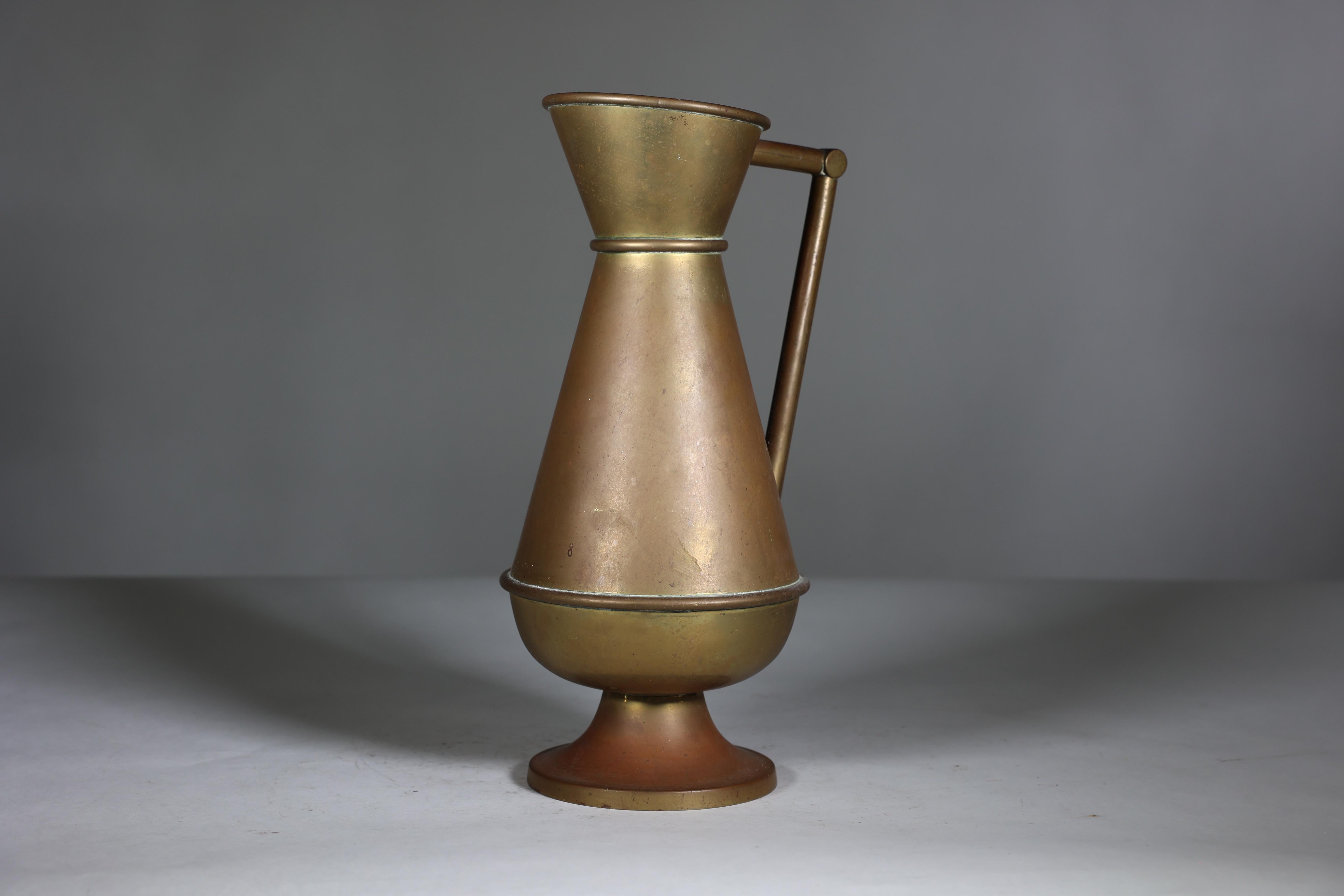 A large Gothic Revival heavy brass jug with a simple angular form and handle. In Good Condition For Sale In London, GB