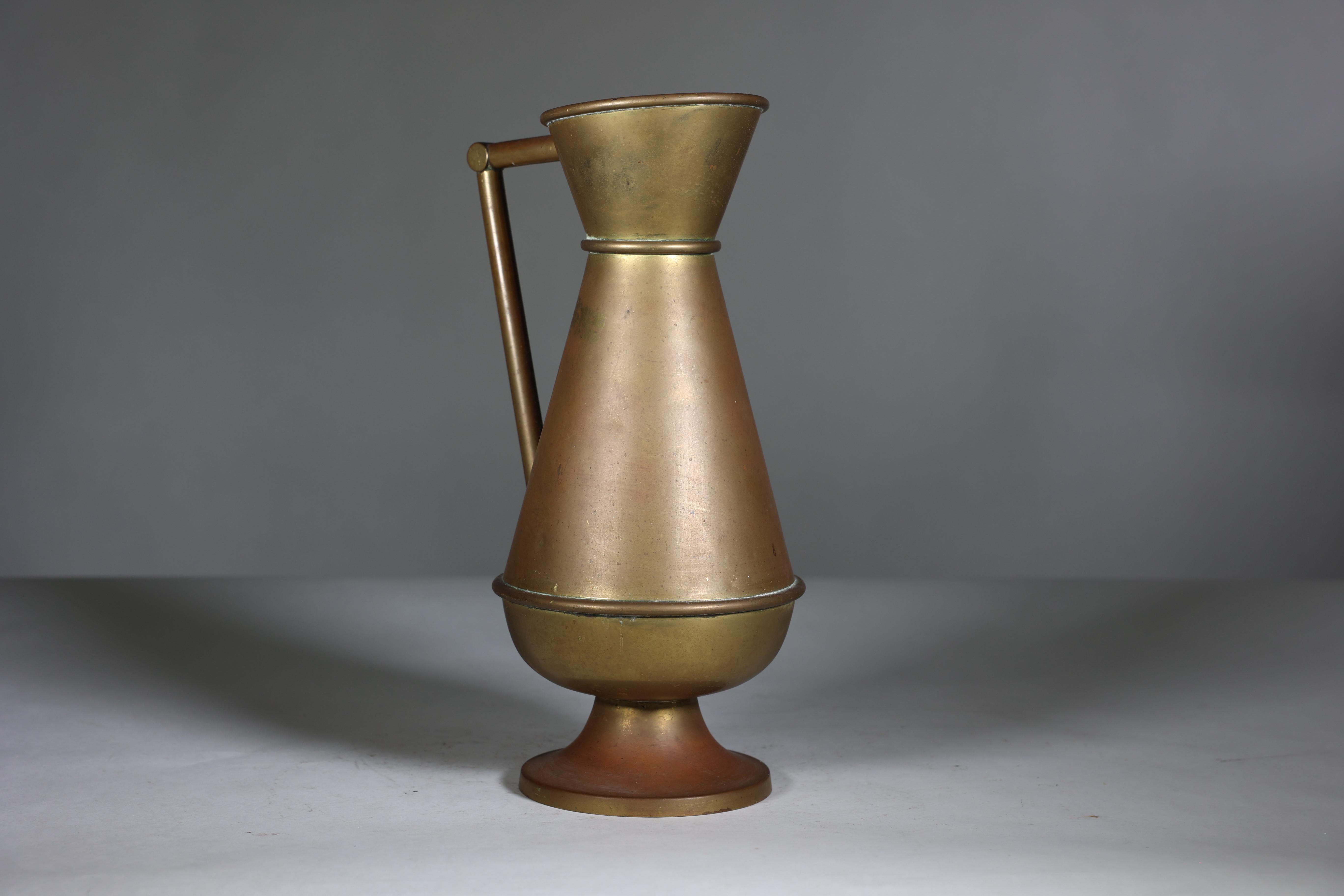 Brass A large Gothic Revival heavy brass jug with a simple angular form and handle. For Sale