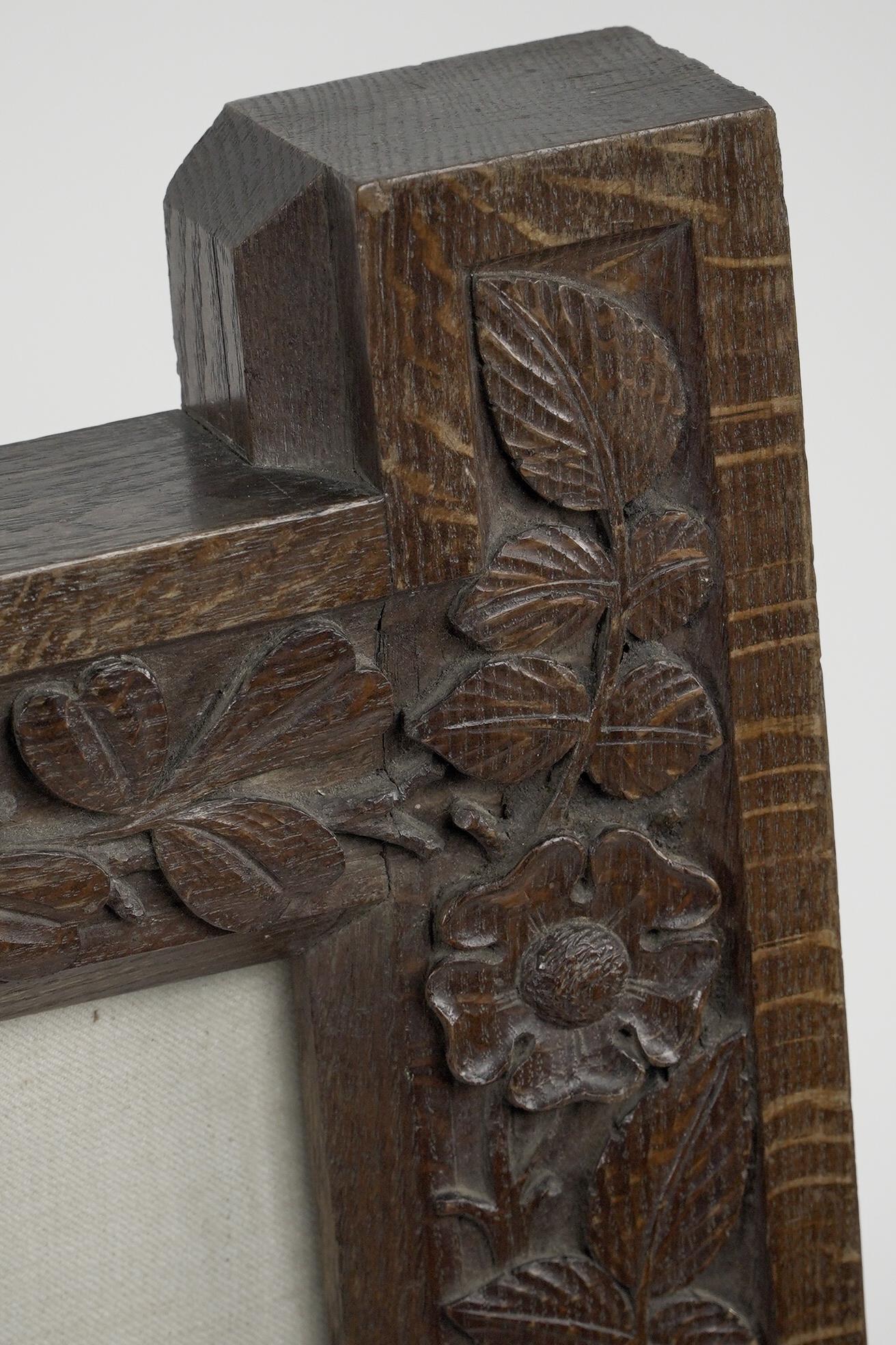A large Gothic Revival picture frame with stylized floral carvings For Sale 11