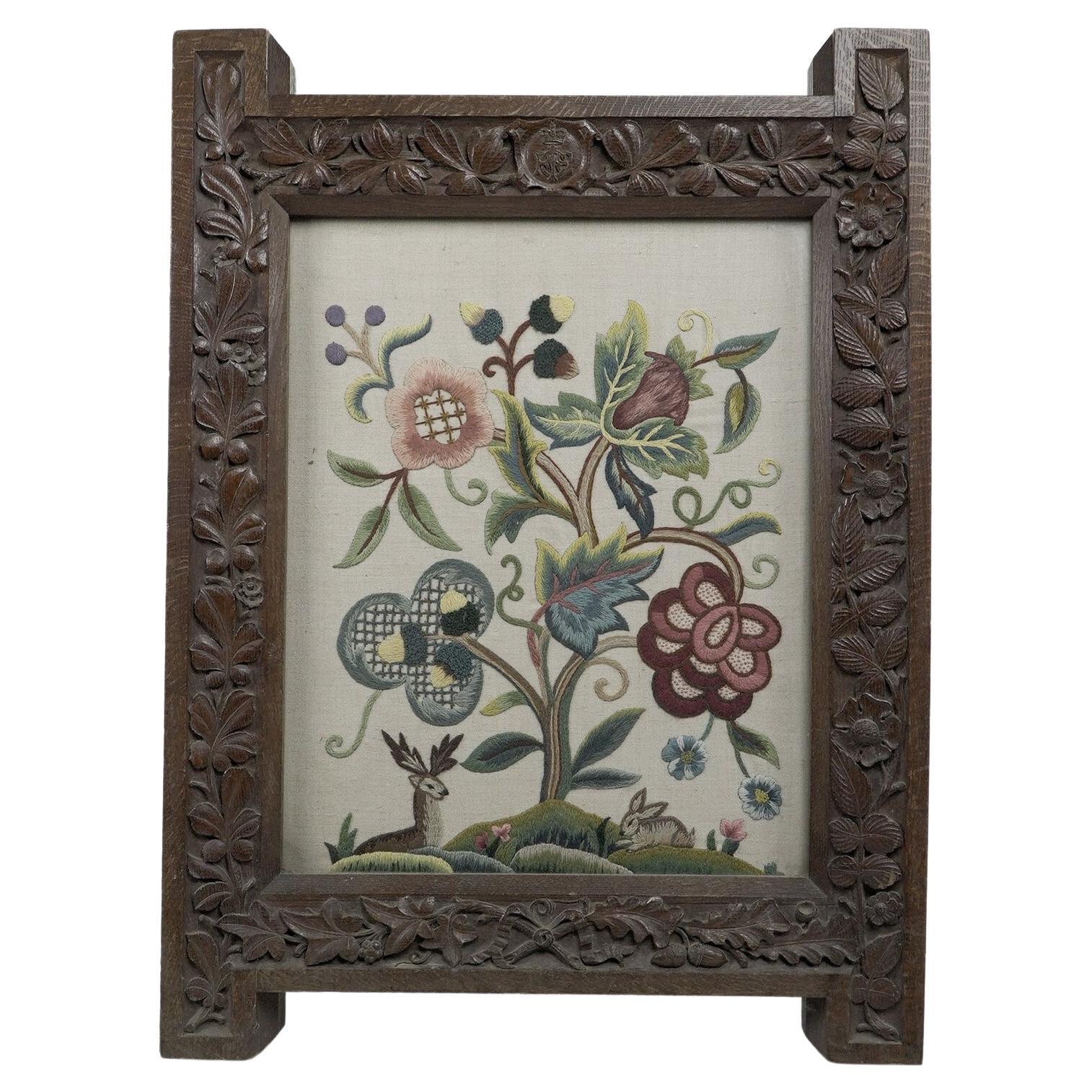 A large Gothic Revival picture frame with stylized floral carvings For Sale