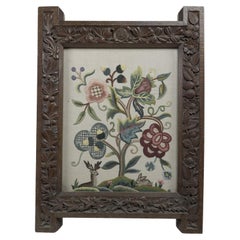 Used A large Gothic Revival picture frame with stylized floral carvings