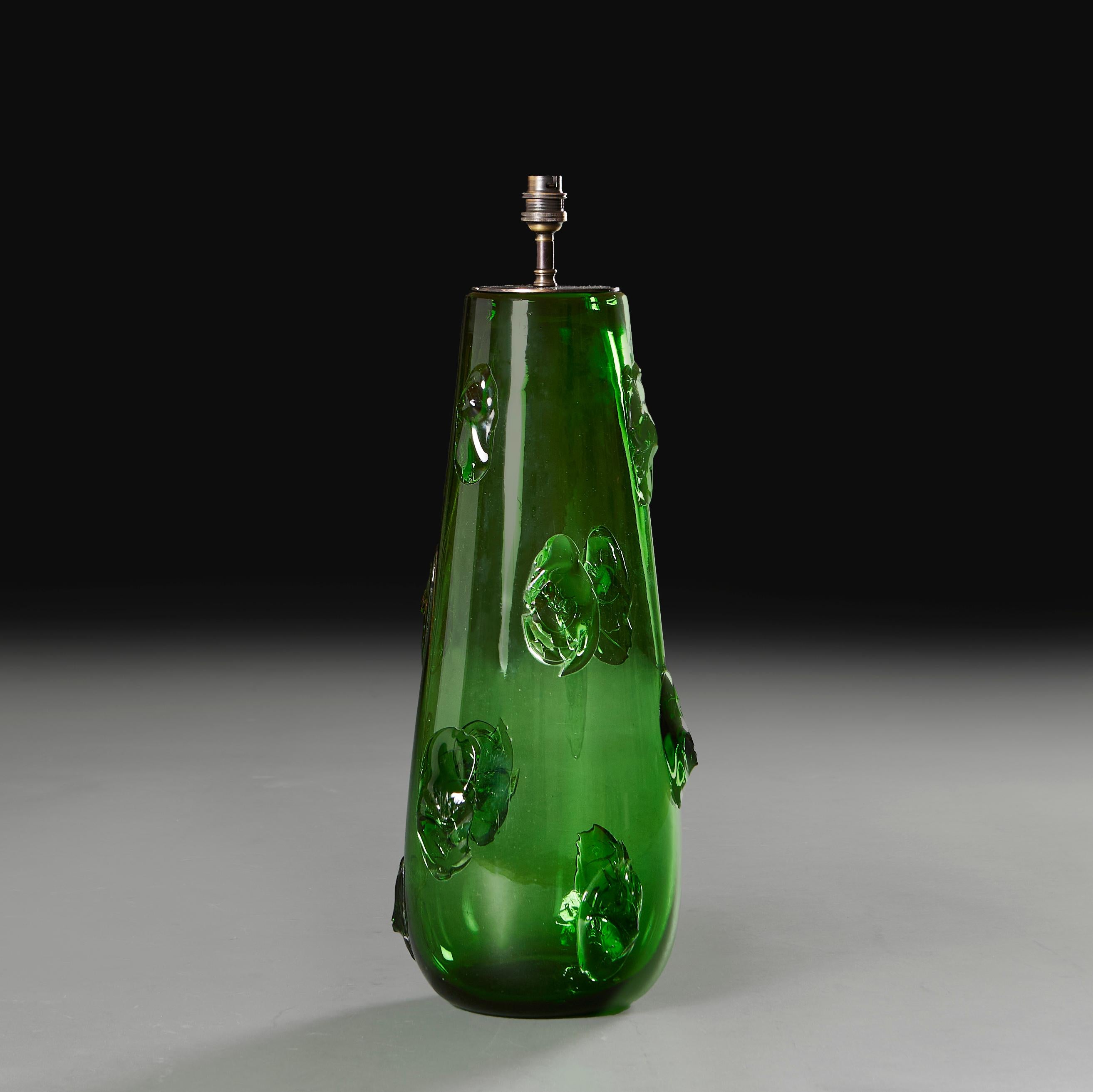  Italy, circa 1960

A green Empoli glass vase of large tapering form with hot applied prunt decoration to the surface, now converted as a lamp. 

Height 49.00cm
Diameter 19.00cm

Please note: This is currently wired for the UK with BC bulb fitting,