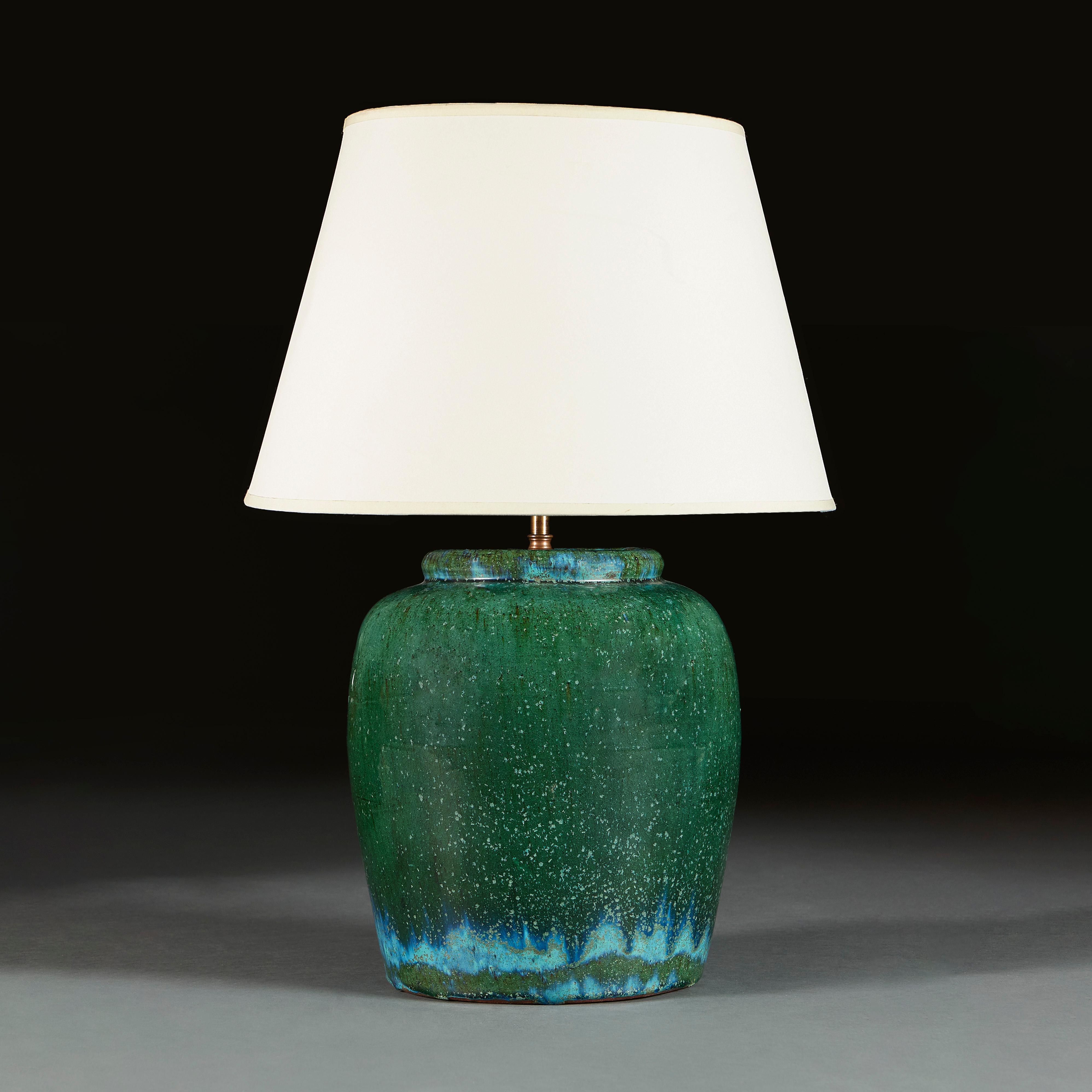 France, circa 1940.

A midcentury French art pottery vase of large scale with strong green an turquoise slip glaze, now converted as a lamp. 

Measures : Height of vase cm 35.00cm
Height with shade cm 64.00cm
Diameter of base cm 25.50cm.