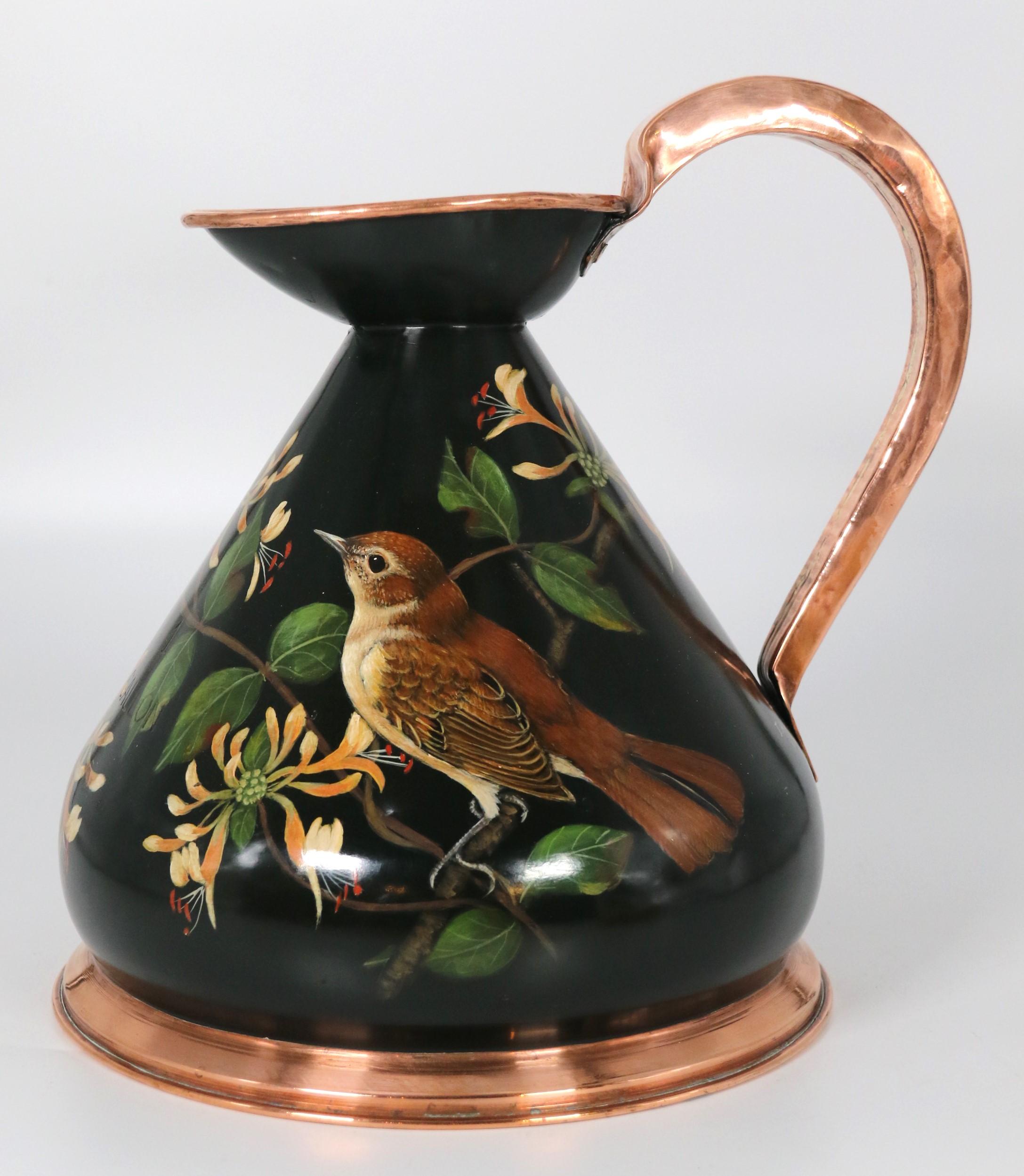 This most unusual and highly decorative English copper cider or ale jug holds a full gallon and is stamped with this measure on the front.
The jug also has a lead maker's seal on its rim.

The unique feature of this lovely heavy copper jug is the