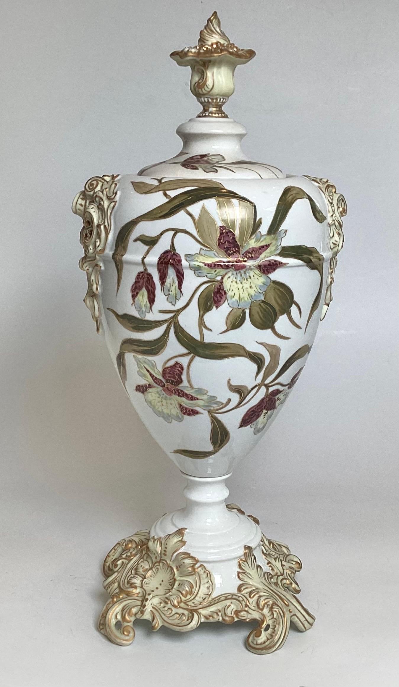 A beautiful Rococo style hand painted porcelain covered urn by E.S. Erdmann, Germany The all over floral design with highly decorated sides and base, 22 inches tall 