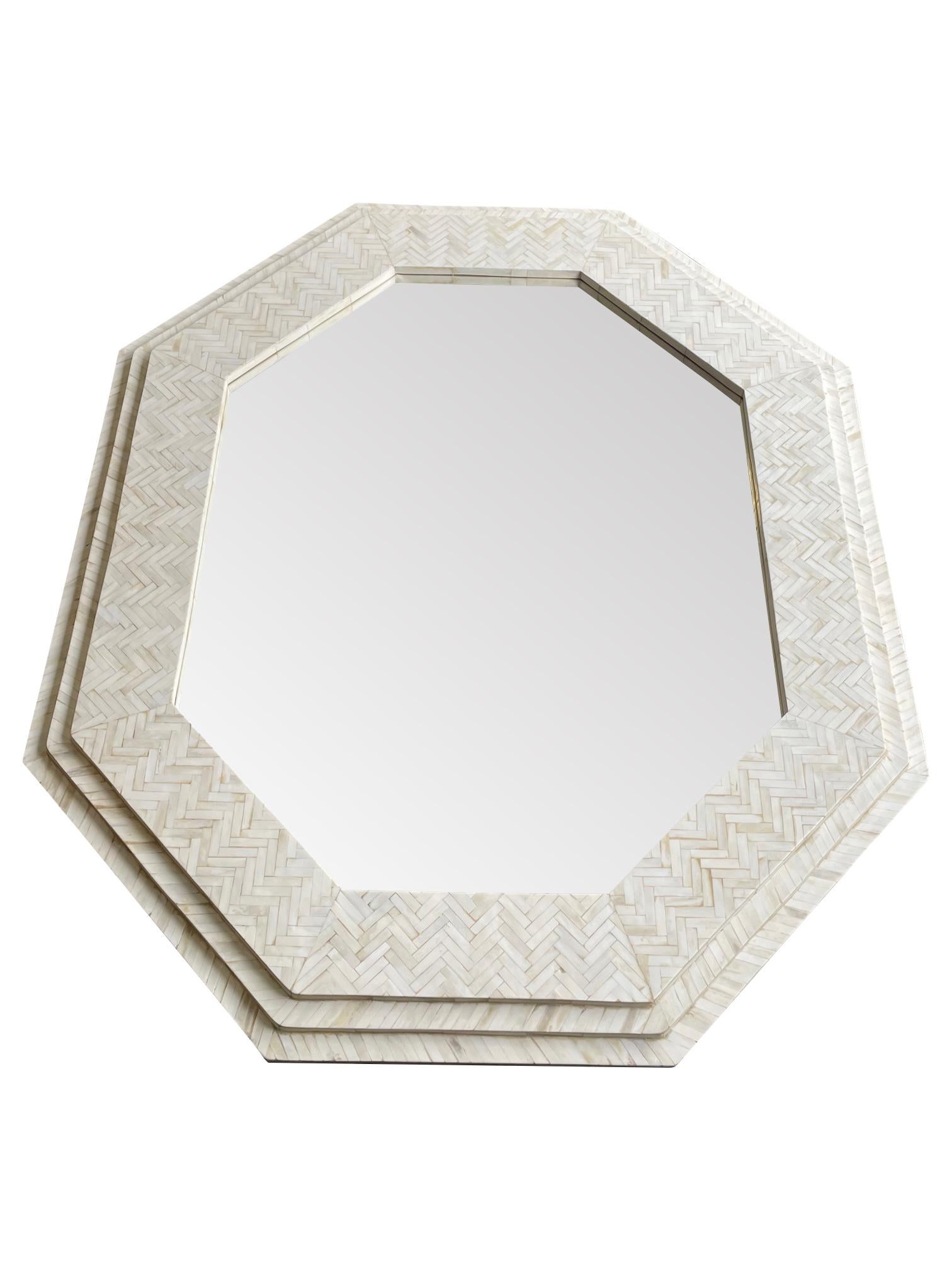 A large handmade inlaid bone octagonal mirror in the style of Enrique Garcel.