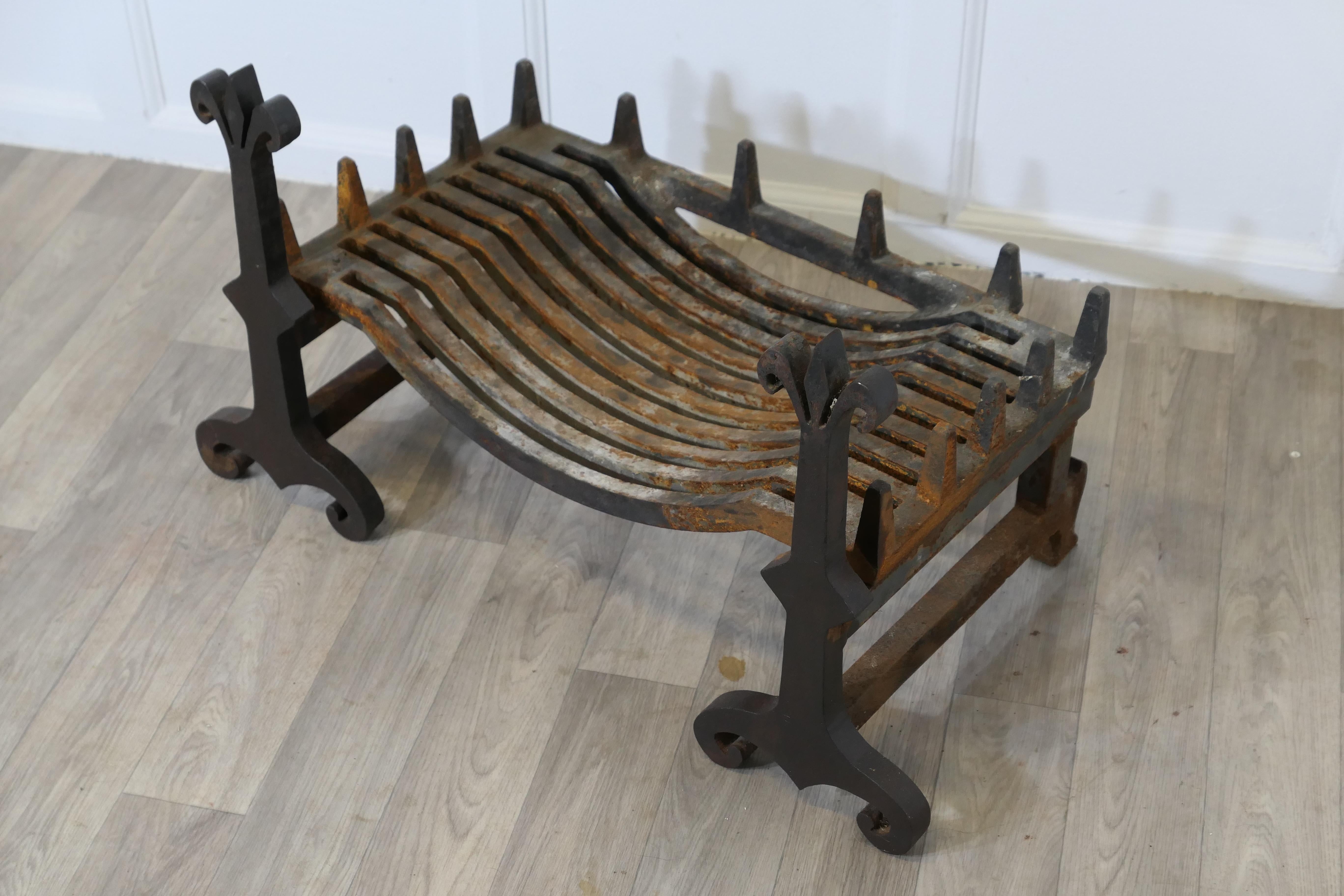 Early 20th Century A Large, Heavy Pair of Late 19th Century Iron Andirons Complete with Grate For Sale