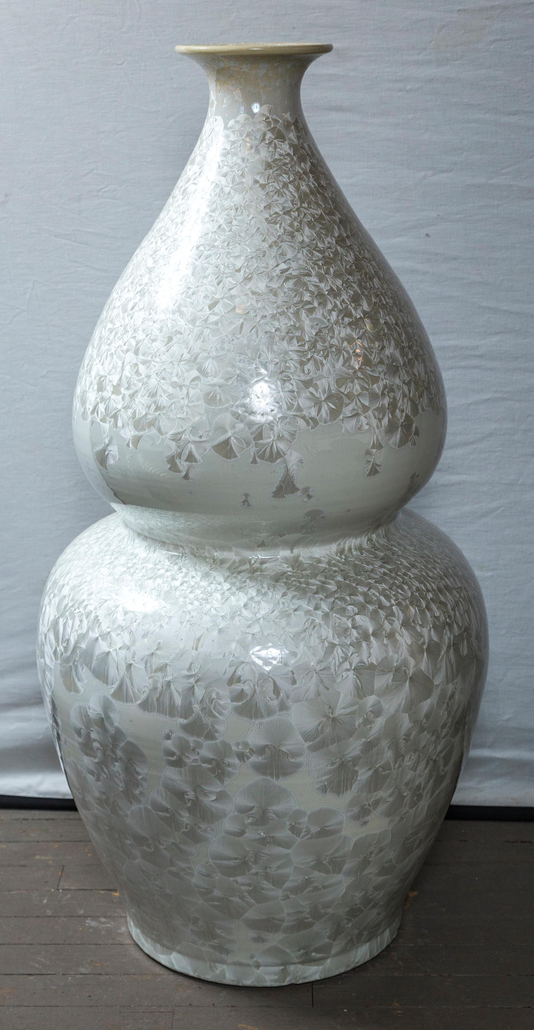 Double gourd form floor vase. White on white decoration. The top 