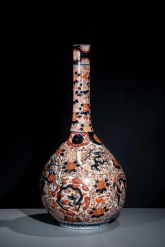 A large Imari vase with dragon, phoenix, and flowers