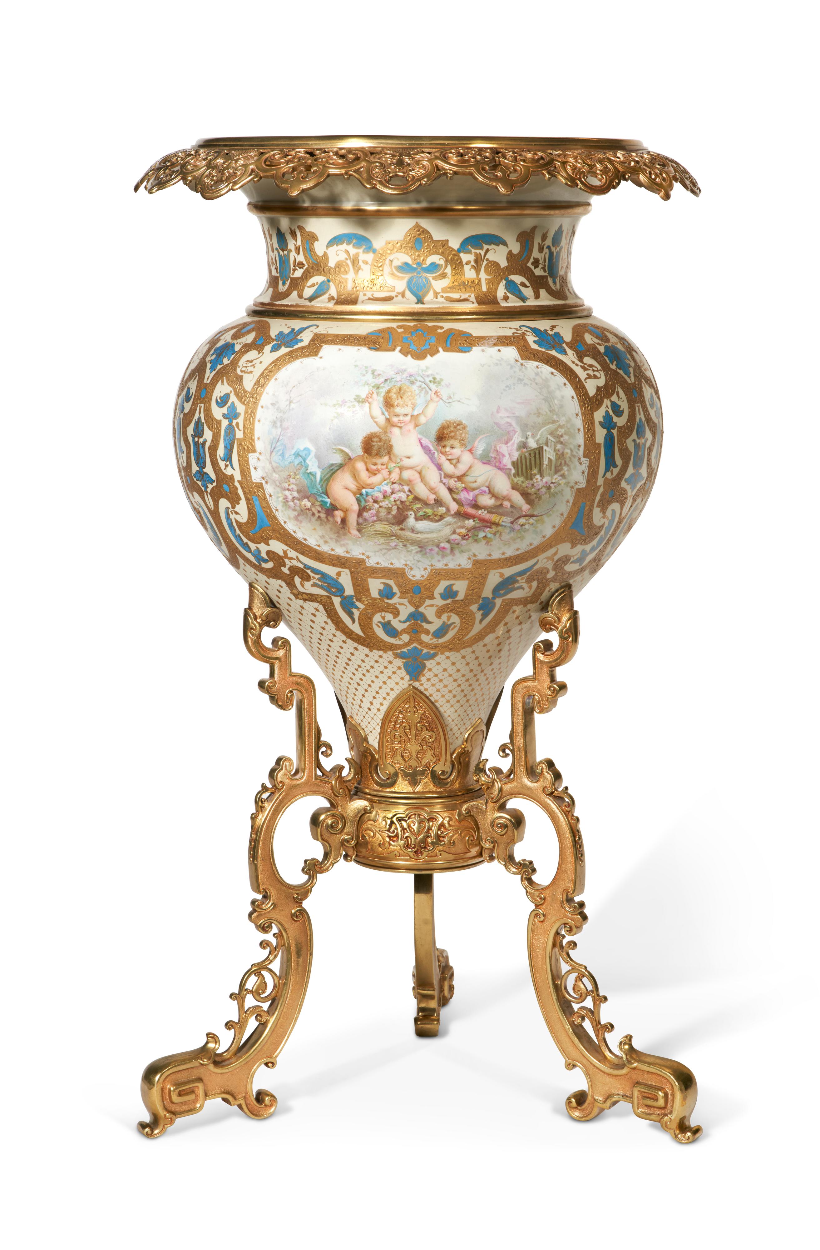 A Large & Important French 19th C. Louis XVI Style Sevres Porcelain Ormolu Mounted Jardiniere. This magnificent piece is of a baluster form with an externally mounted ormolu rim which is cast with spectacularly with an open fretwork design. The