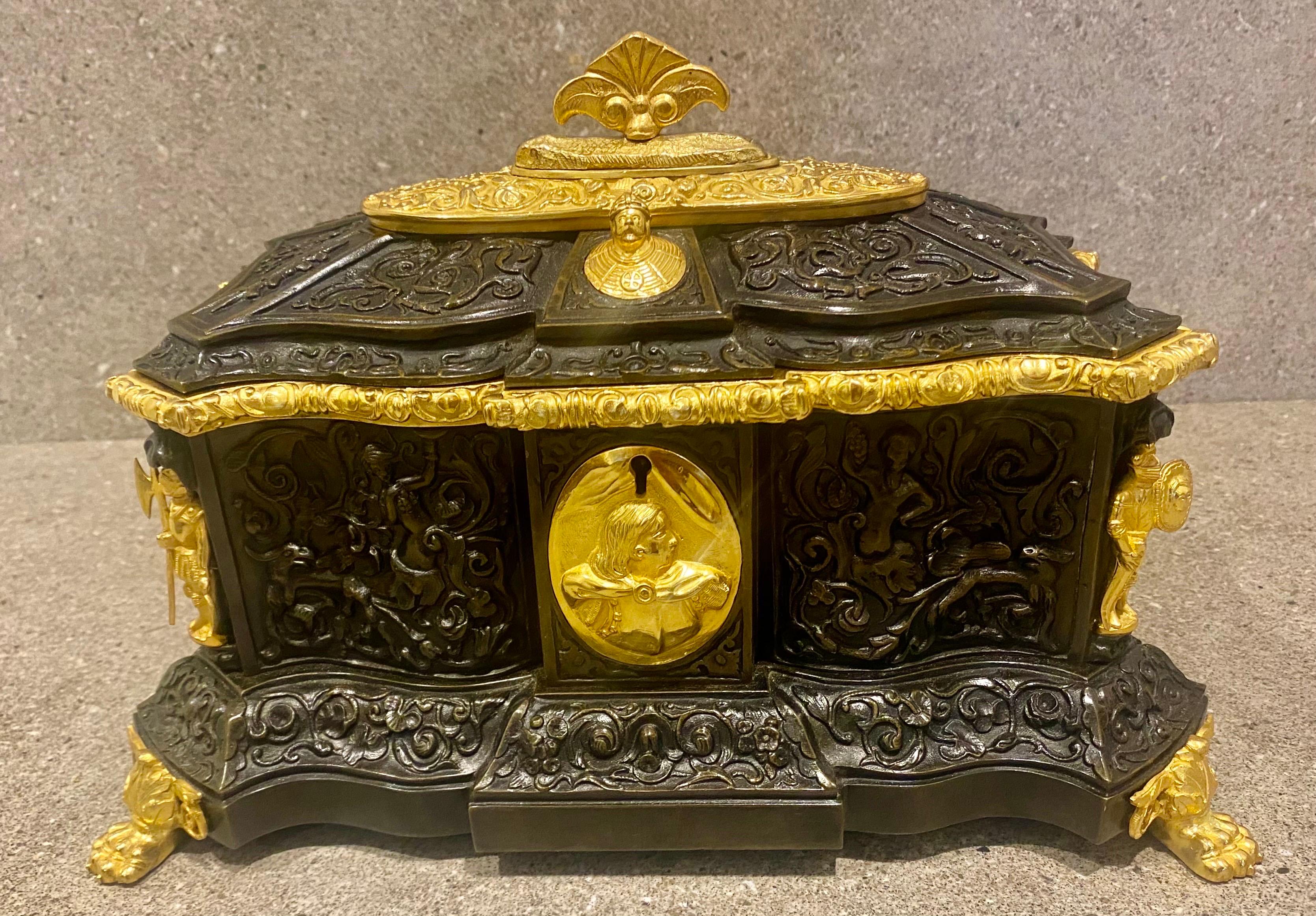  This large heavily cast bronze Jewelry box was made in France in the mid 19th century and is made in the form of a medieval coffer.
It is superbly detailed with flowers Leaves Cherubs and decorative strapwork cast with very deep relief carving to