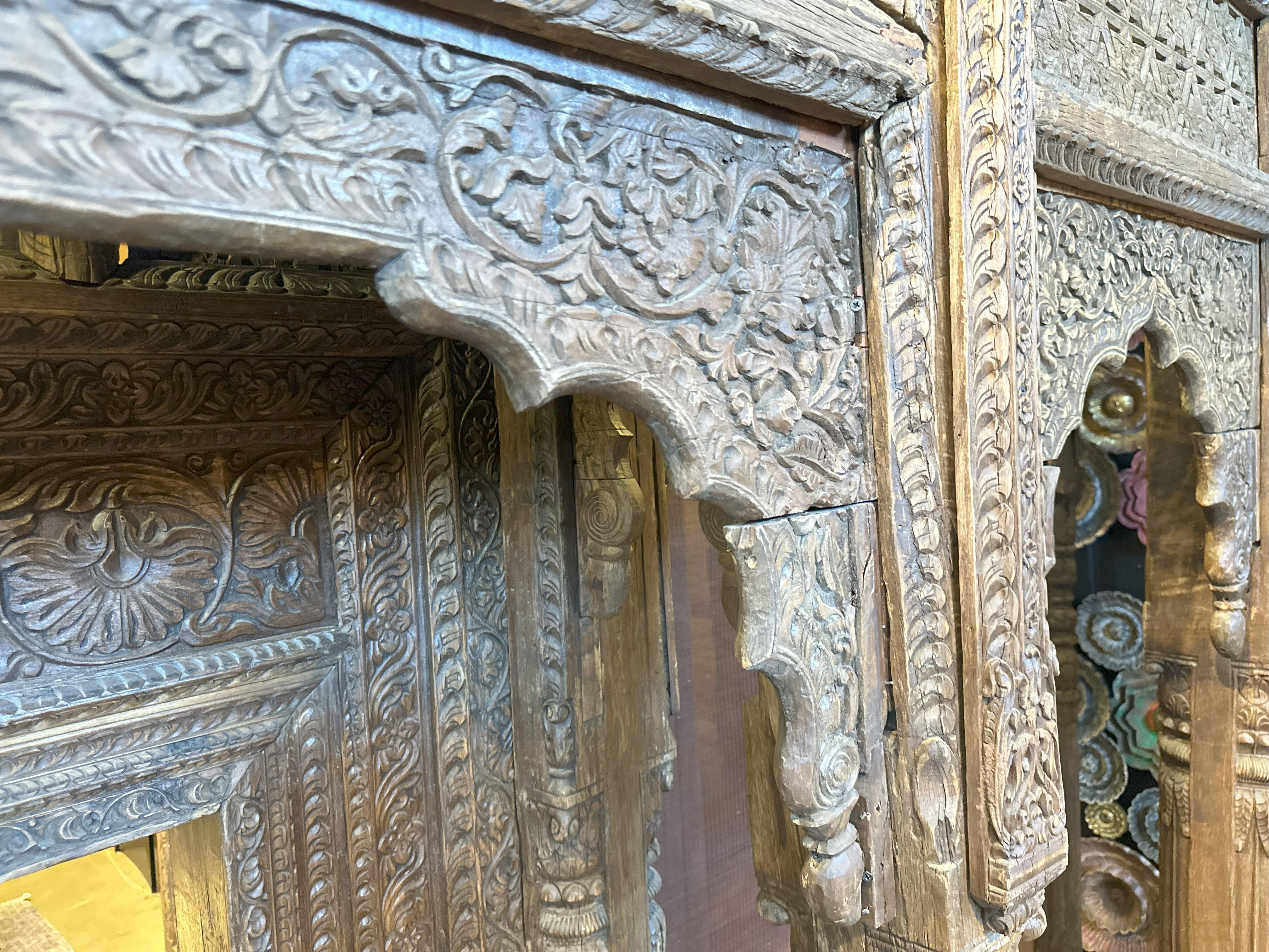A Large Indian Architectural  Facade With Doorway and Flanking Window Seats 1