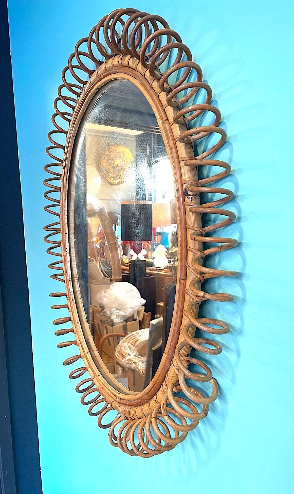 A large Italian 1970s bamboo oval mirror with spiral frame by Franco Albini 1