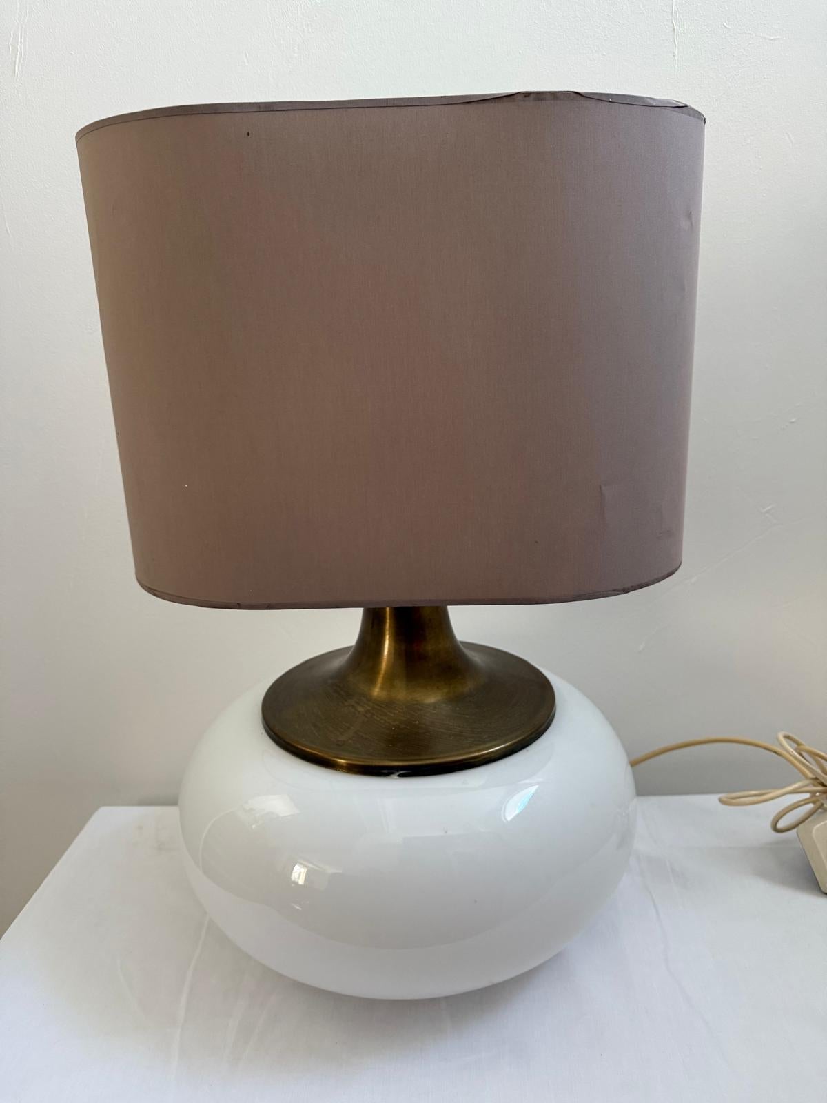 A large Italian c.70's table lamp in brass and mouth blown opaline glass, the base is fitted for electricity and holds three bulbs, lamp shade not included,
wired for UK standart  