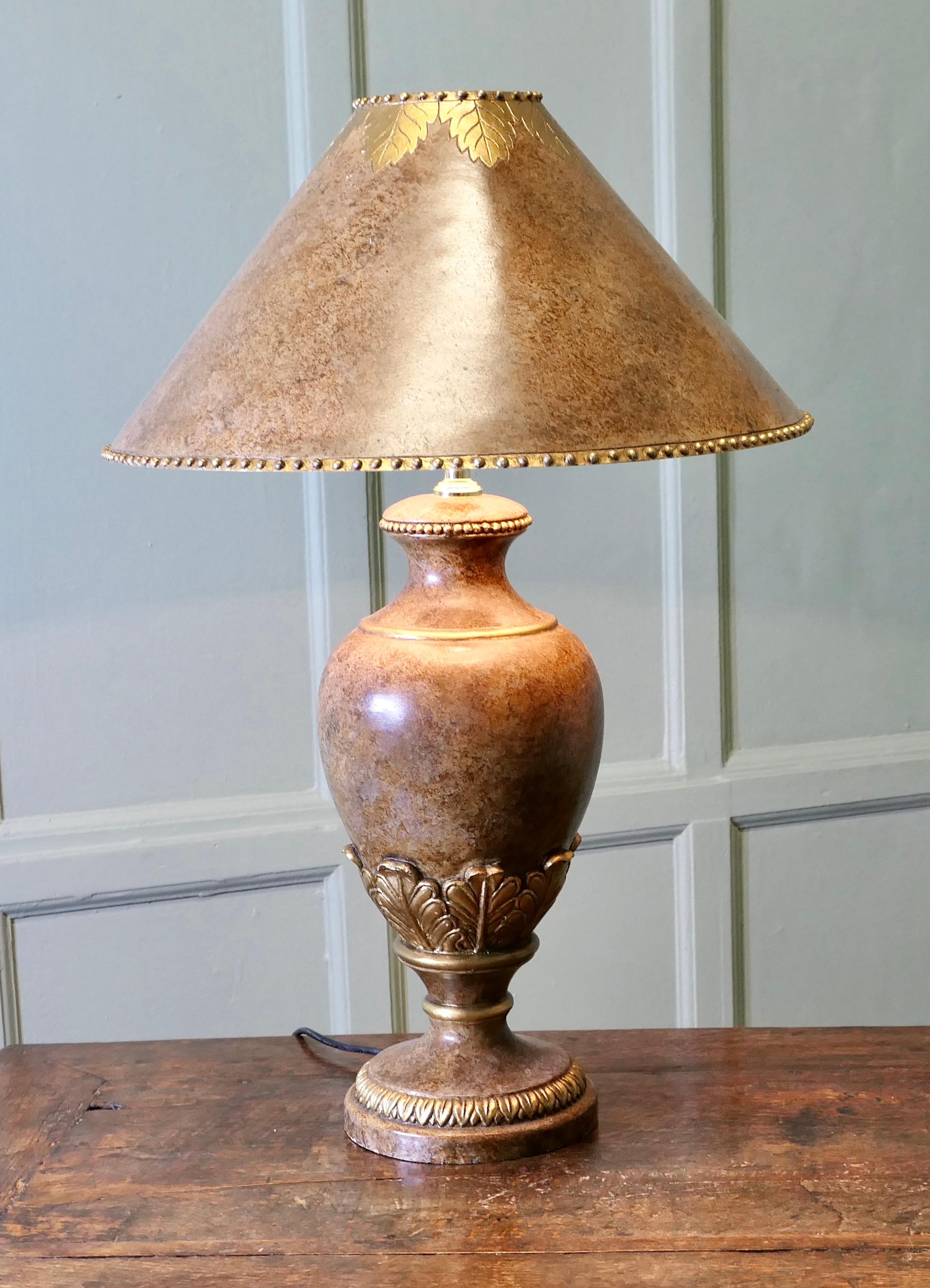 A Large Italian Simulated Marble Table Lamp 

The lamp has a large baluster ceramic bowl which is decorated as simulated Italian marble detailed with Gold leaves, it has its own shade which matches the marble and gold finish of the base

The lamp is