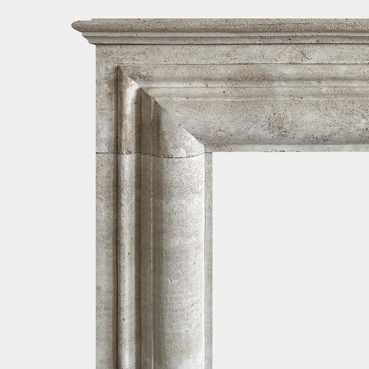 Hand-Carved A large Italian Travertine Stone Bolection Fireplace Mantel  For Sale