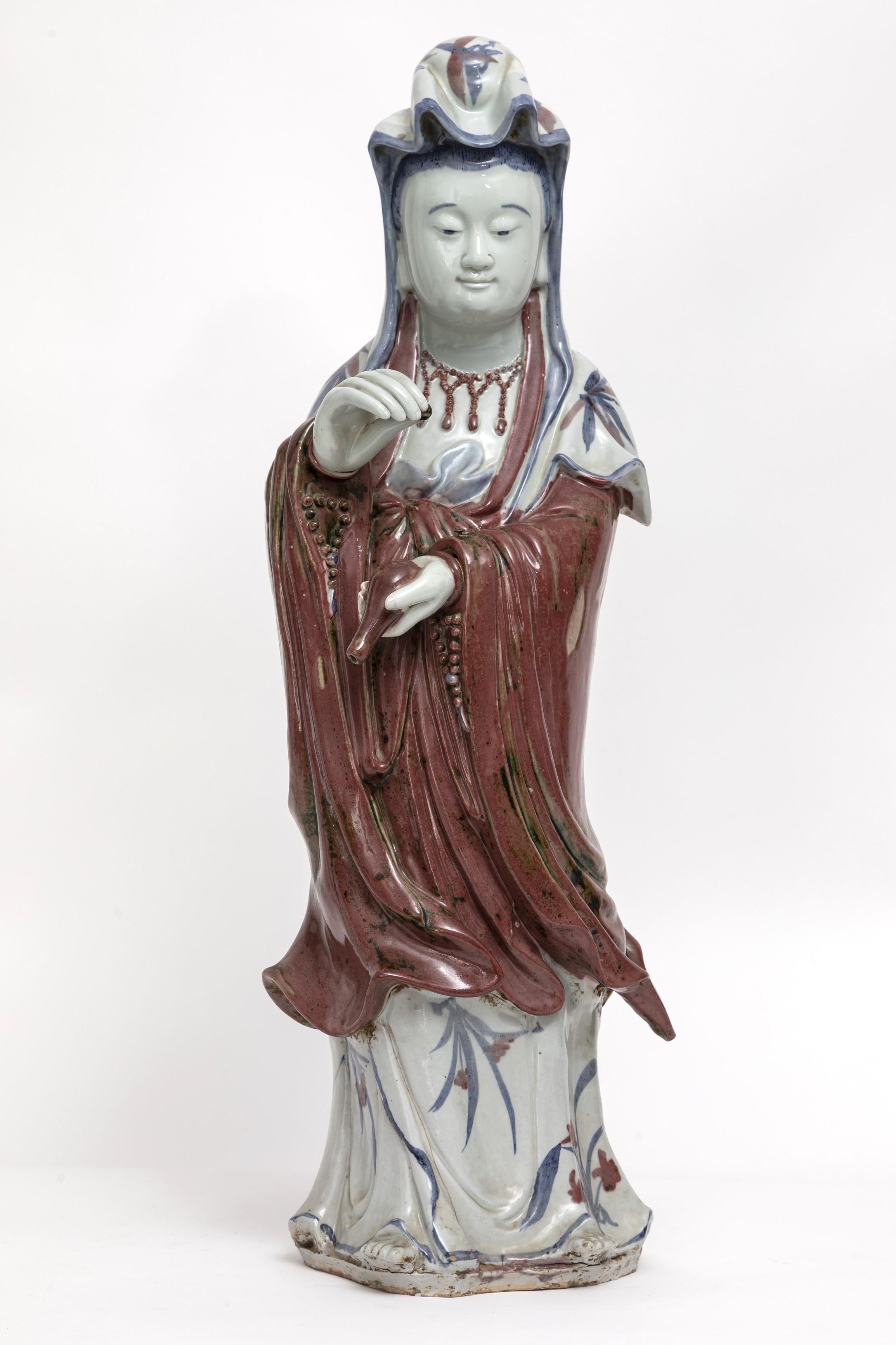 Introducing a Magnificent Japanese Porcelain Figure of a Guanyin - A Monumental Expression of Serenity and Grace.

Behold this majestic depiction of Guanyin, rendered in porcelain with remarkable skill and artistry. Standing almost waist-height,