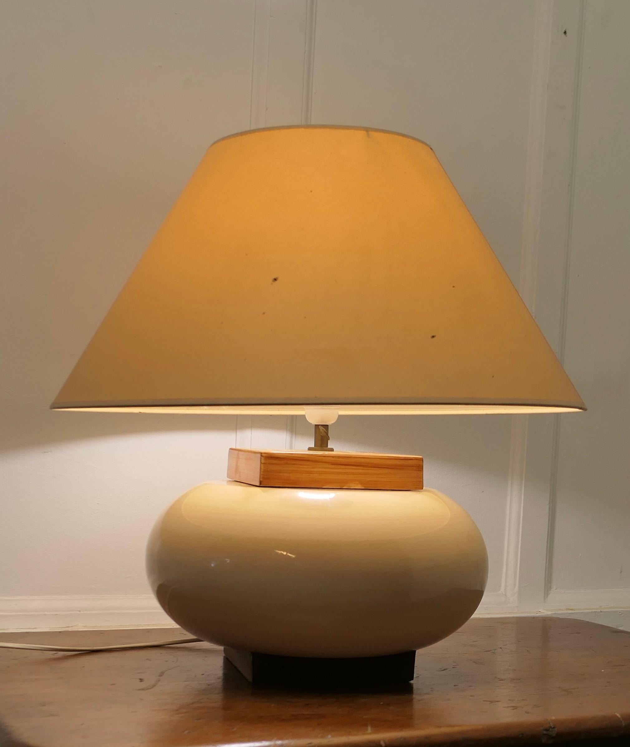 A Large Kostka Sideboard Pebble Lamp

A Large French pebble set between Rectangular base and top, the lamp is in relaxed Summer Colours and has its original cream Coolie Lampshade
All working and a great looker
The lamp is 21” tall, and 22” in