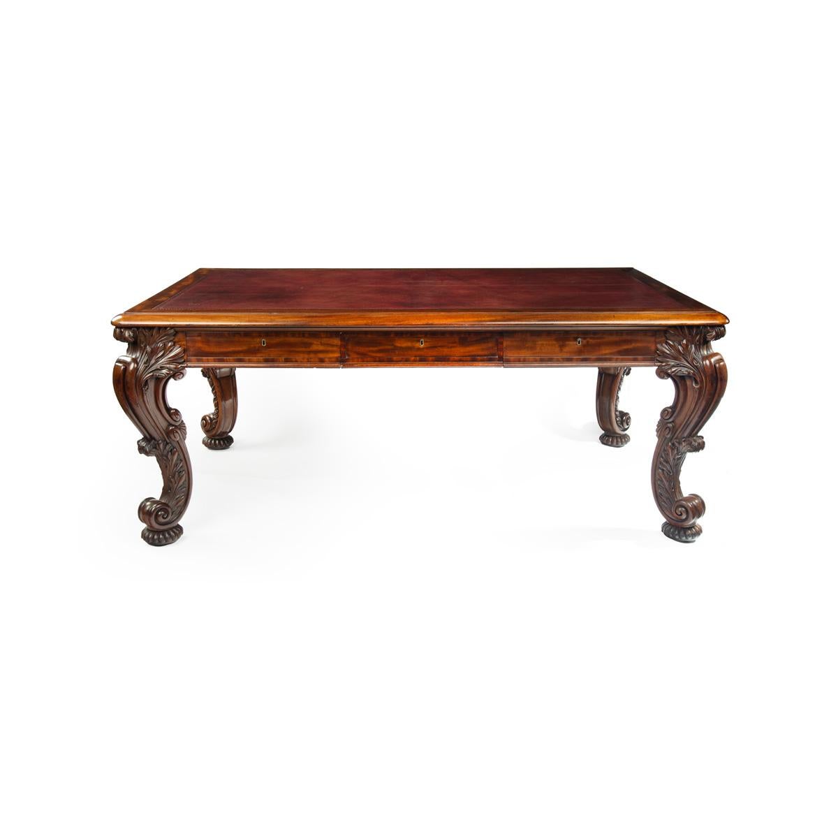 A large late Regency mahogany partner’s library table attributed to Gillows, the leather inset rectangular top above six frieze drawers, the frieze cross banded,  raised on powerful double scroll legs carved with acanthus leaves, the gadrooned pad