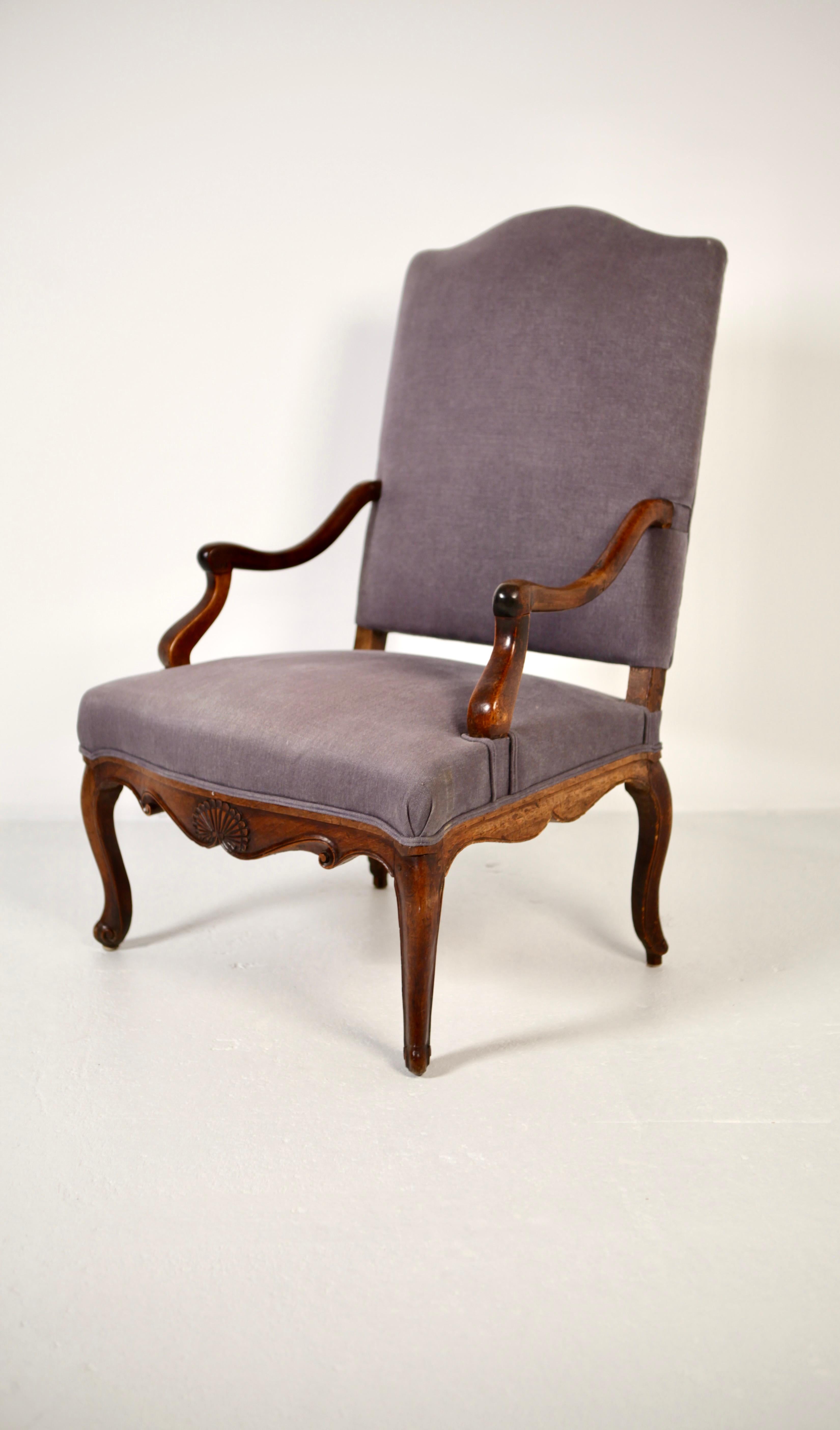 A large and comfortable Louis XV style armchair , France early 19th century.
Upholstered in a grey/ blue linen, the frame in walnut with excellent patina.
 