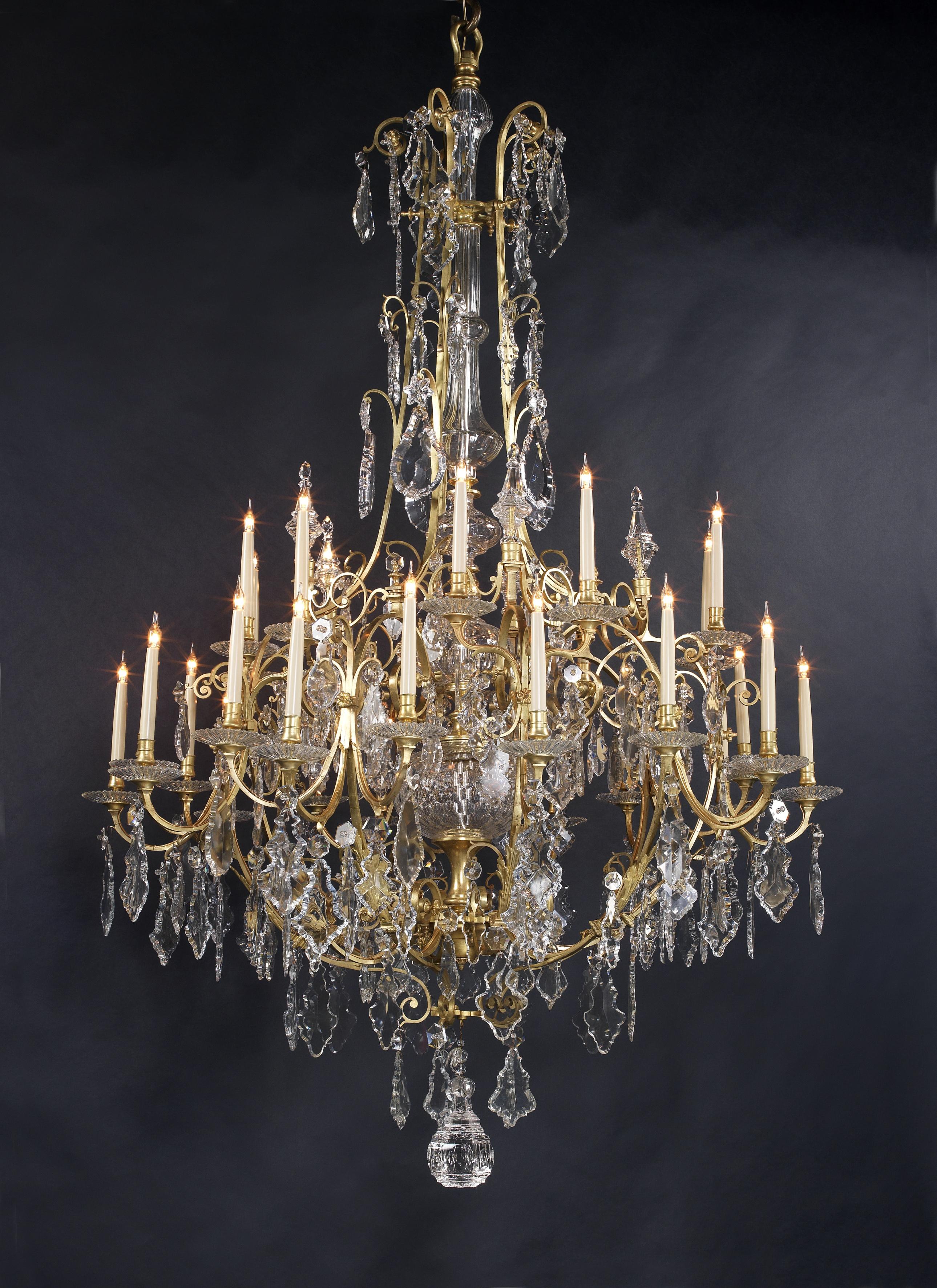 A large and important Louis XV style gilt bronze and cut-crystal thirty-light cage chandelier.

French, circa 1870. 

This fine chandelier is of a grand scale at 223 cm high (88 inches). 

The chandelier has a central cut-crystal baluster stem