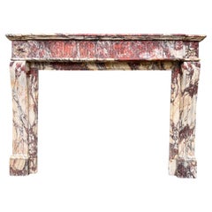 A Large Louis XVI Breche Marble Fireplace Mantel