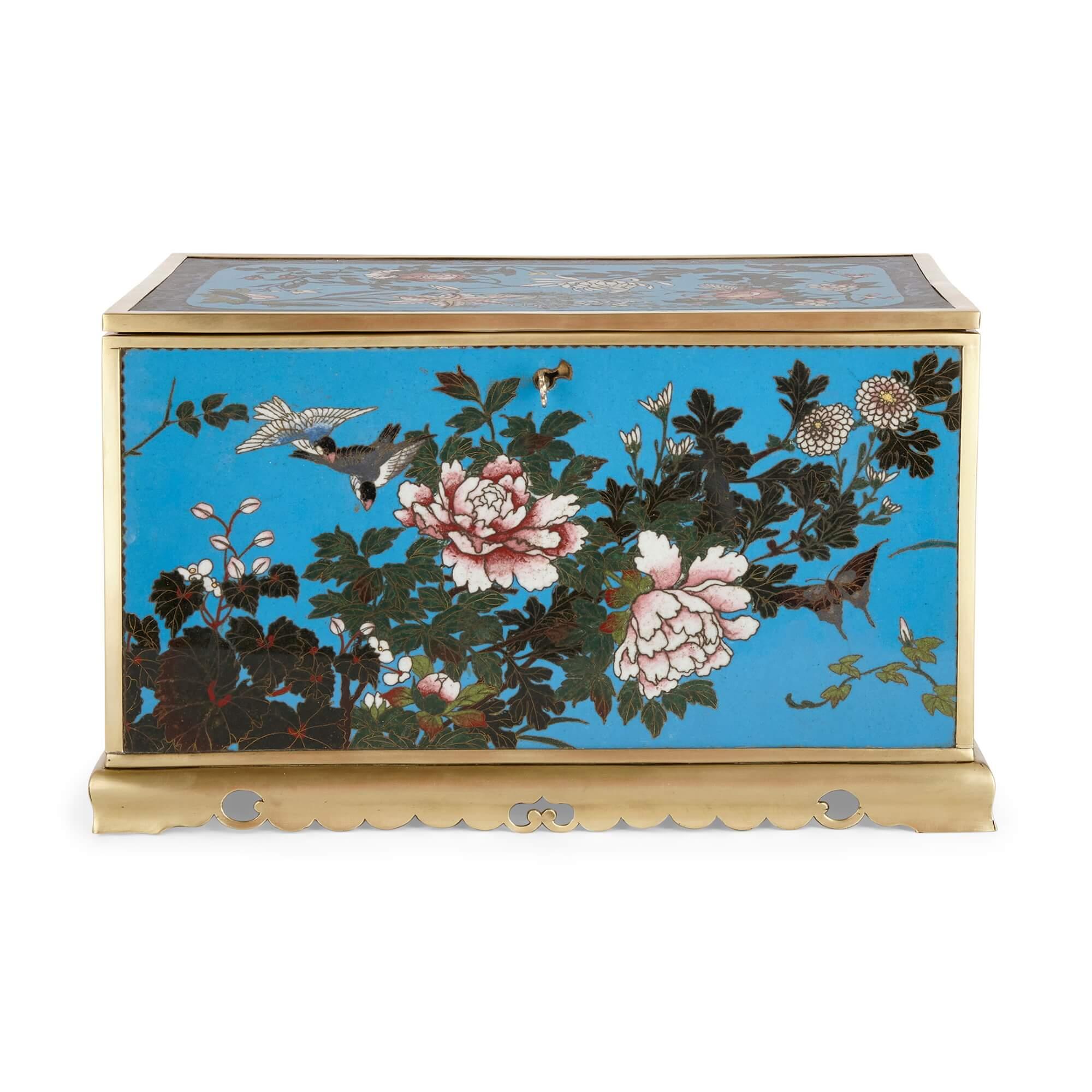 A large Meiji period brass and cloisonné enamel casket
Japanese, Late 19th Century
Height 20cm, width 35.5cm, depth 22cm

This beautiful piece is a Japanese casket cast in brass, and features a series of vibrant, elegantly crafted cloisonné