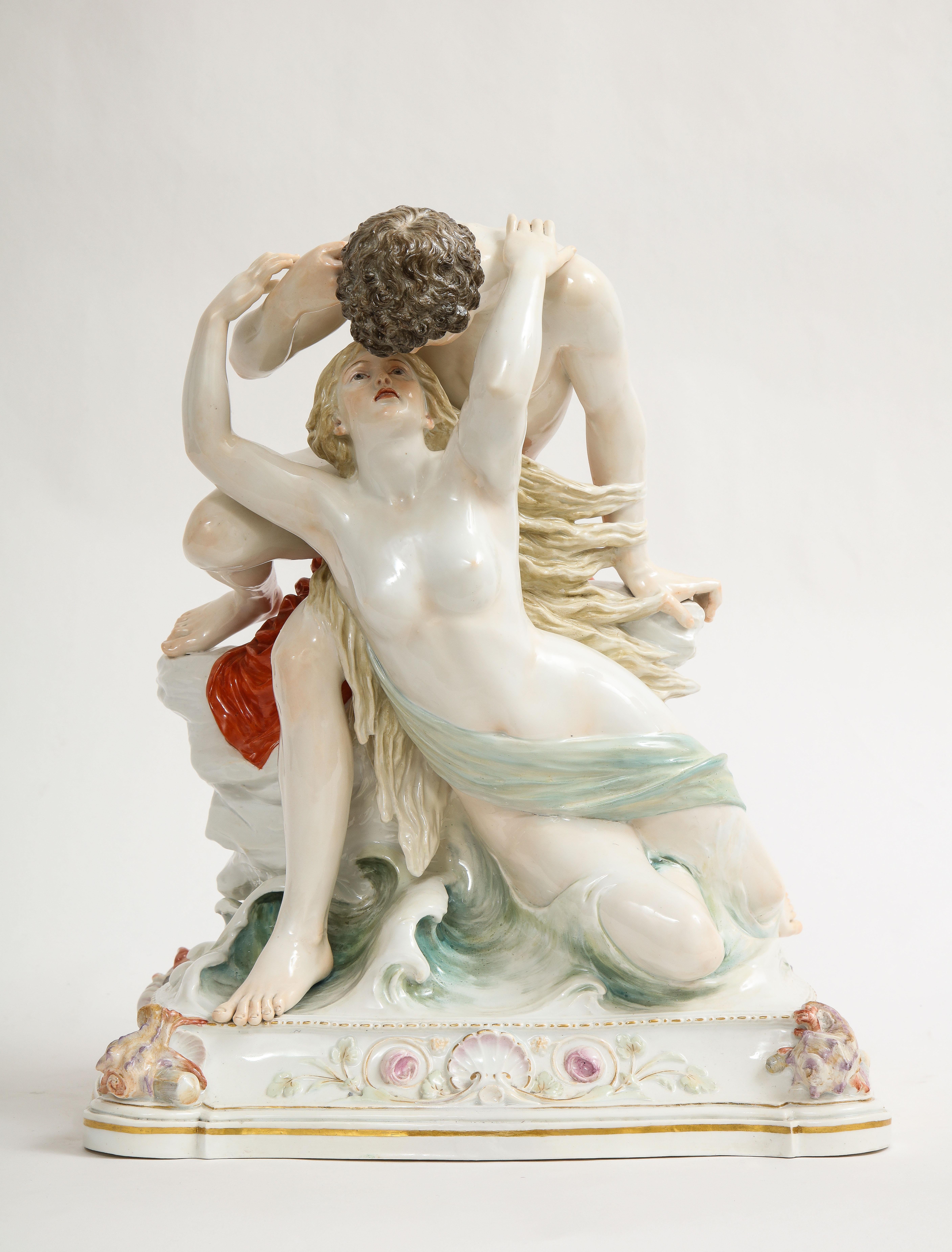A Large Meissen Porcelain group of lovers kissing in the Ocean on a Rock. This piece is truly spectacular in both quality and size. The pair of lovers are seen perched a top a large rock in the middle of a cracking ocean. The waves are crashing by