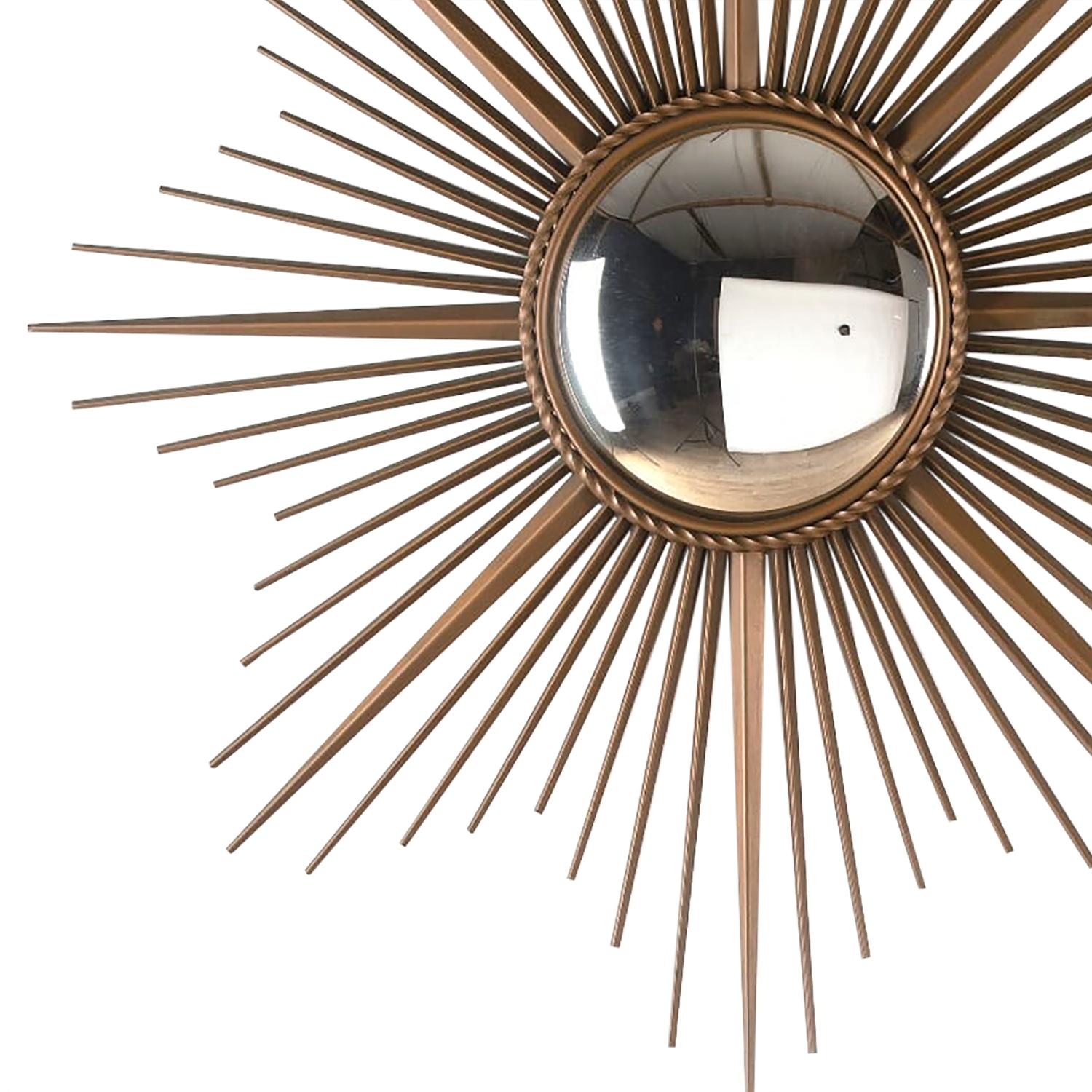 A metal convex mirror manufactured by the French company Chatty Valarus. There is a second mirror available of the same size and dimensions that would make a pair of mirrors if required.