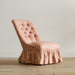 A large mid 19th century walnut slipper chair c1860