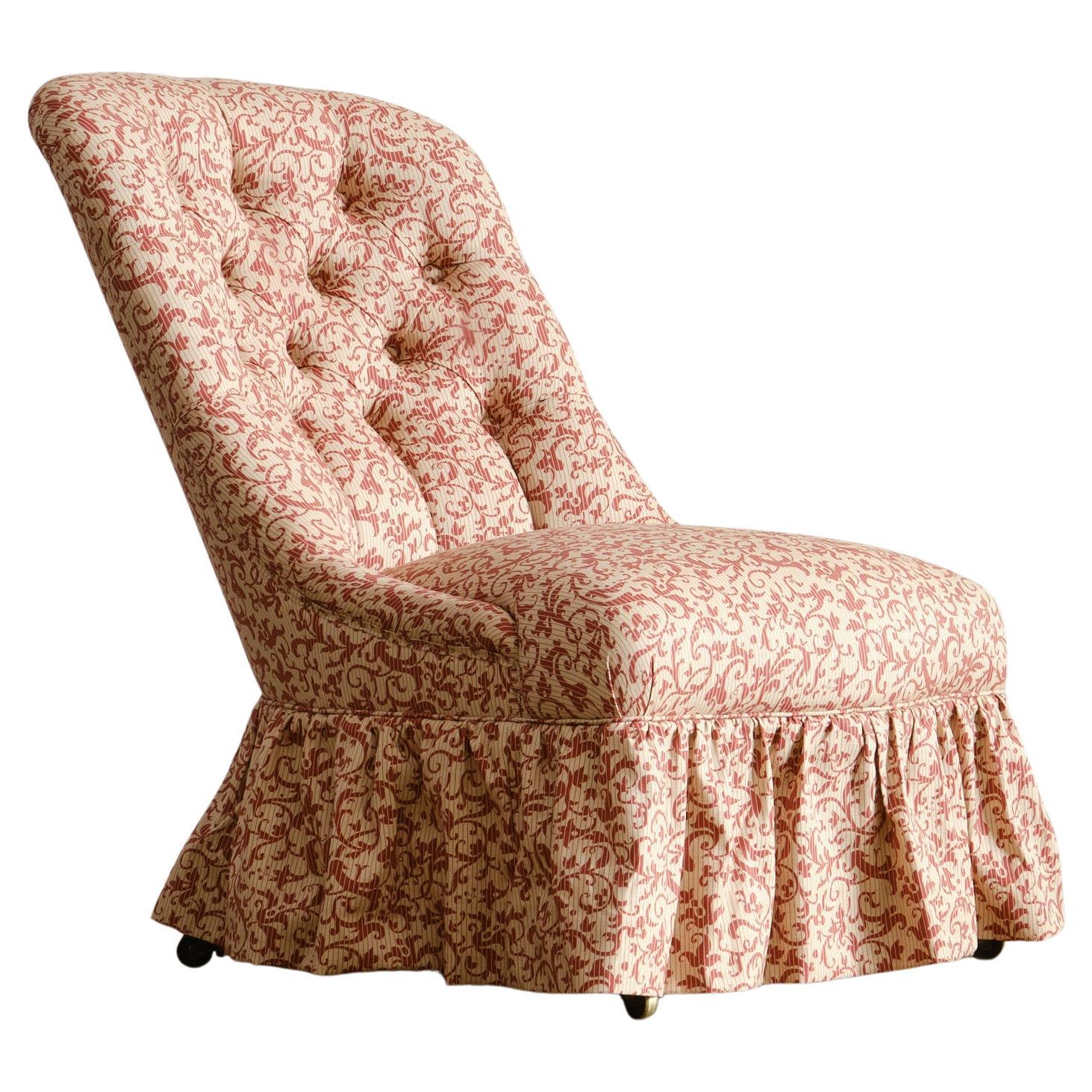 A large mid 19th century walnut slipper chair c1860