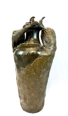 A large monumental Art Nouveau bronze peacock vase