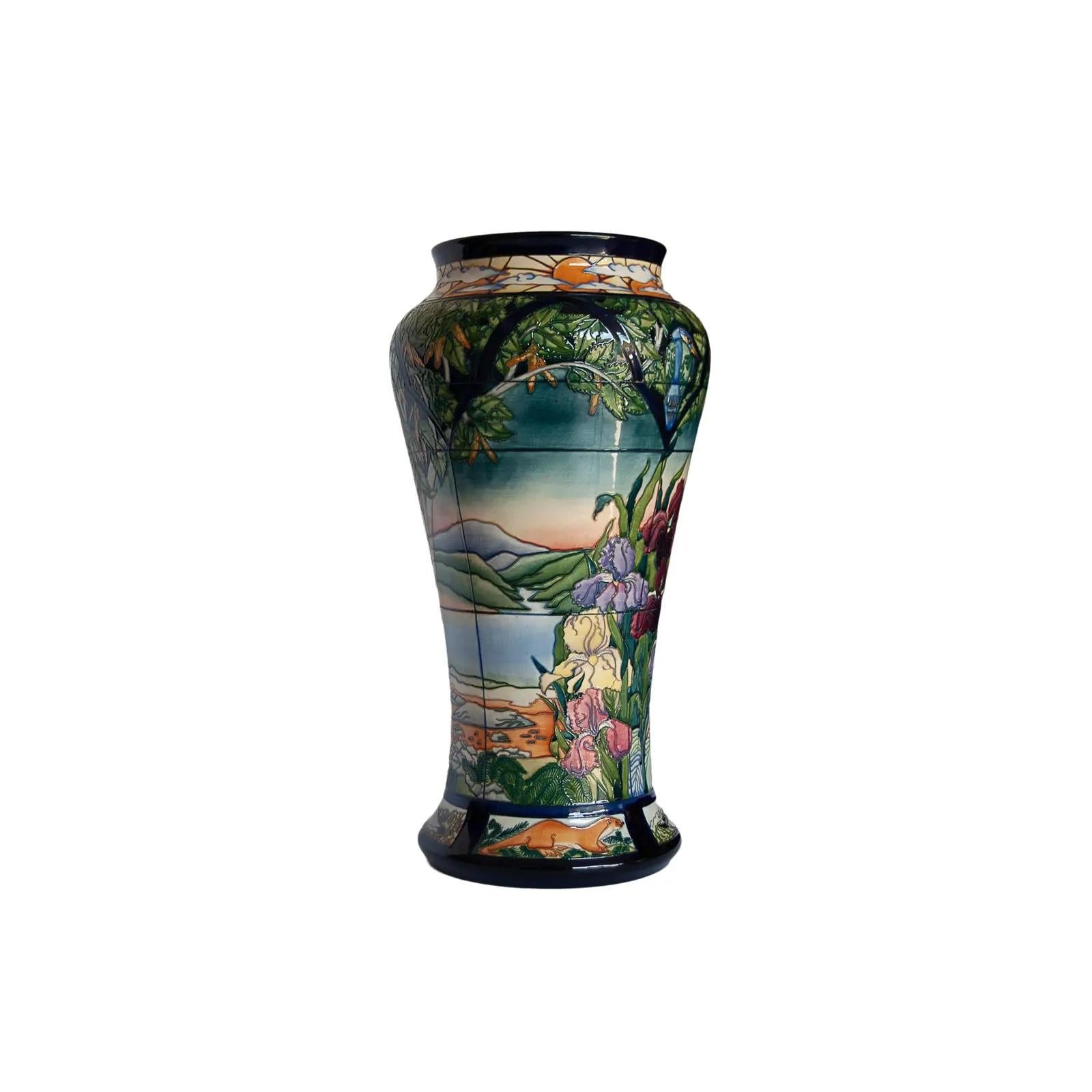 Rachel Bishop for Moorcroft pottery, 'Parramore' a large prestige vase, 
of baluster-form, the tube-lined surface creating a leaded window with day and night alternating views of a mountain landscape, with irises and foxgloves, a silver birtch,