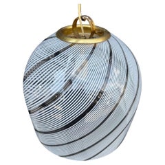 A large Murano swirl glass Tessuto pendant light by Venini